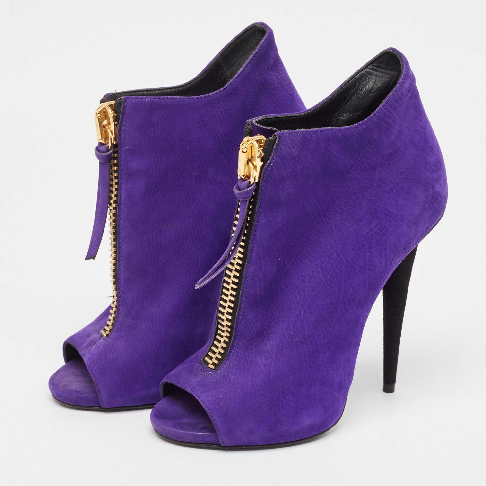 Make a statement with these Giuseppe Zanotti ankle boots for women. Impeccably crafted these chic heels offer both fashion and comfort elevating your look with each graceful step.
