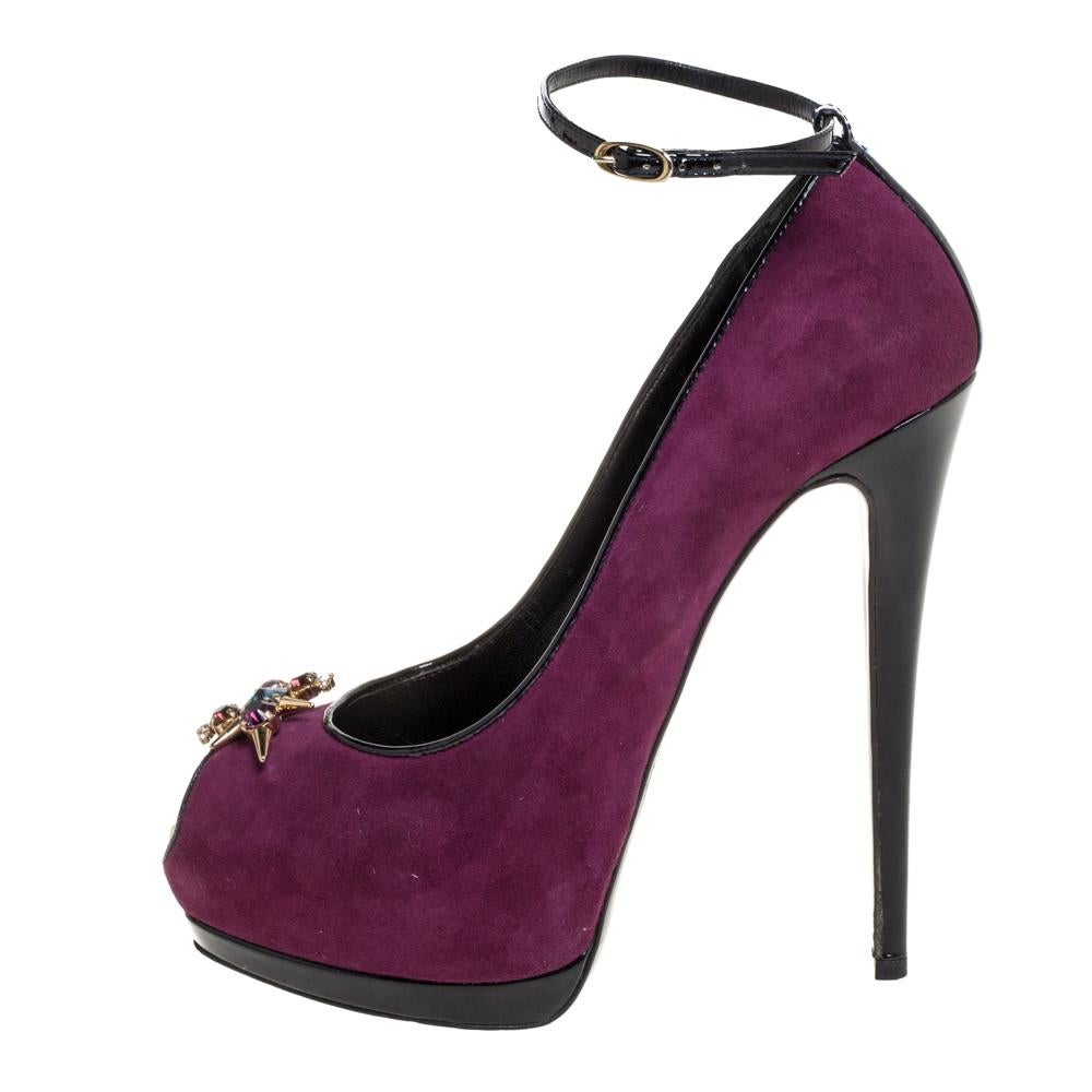 Brimming with unparalleled sophistication, these gorgeous purple pumps from Giuseppe Zanotti are ready to help you fashion a statement look. Crafted from suede and flaunting a peep-toe silhouette, these pumps exhibit crystal embellishments on the