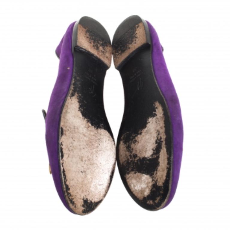 From the house of Giuseppe Zanotti comes this pair of slip-on shoes for casual styling. Crafted with suede, these slippers have a purple surface that gives them a trendy look. The shark tooth embellishments add to the luxurious design.