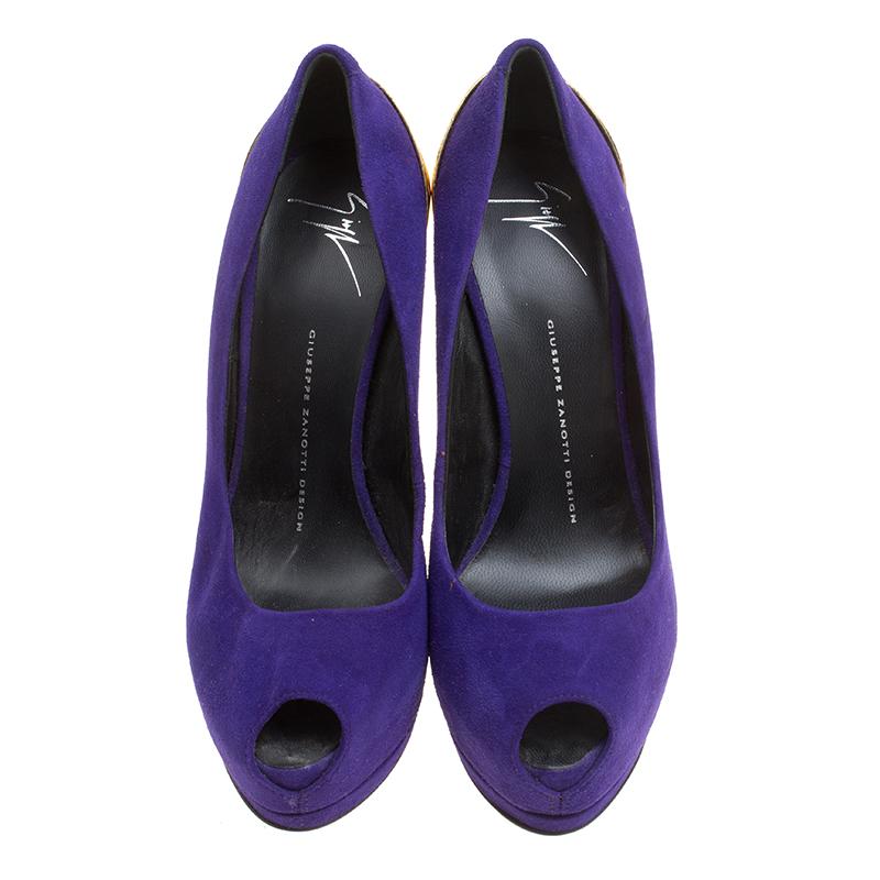 Revamp your footwear collection by adding this pair of Giuseppe Zanotti pumps to it. They are crafted from purple suede and designed with peep toes, platforms and 16.5 cm metal heels that fall from the counters.

Includes: The Luxury Closet
