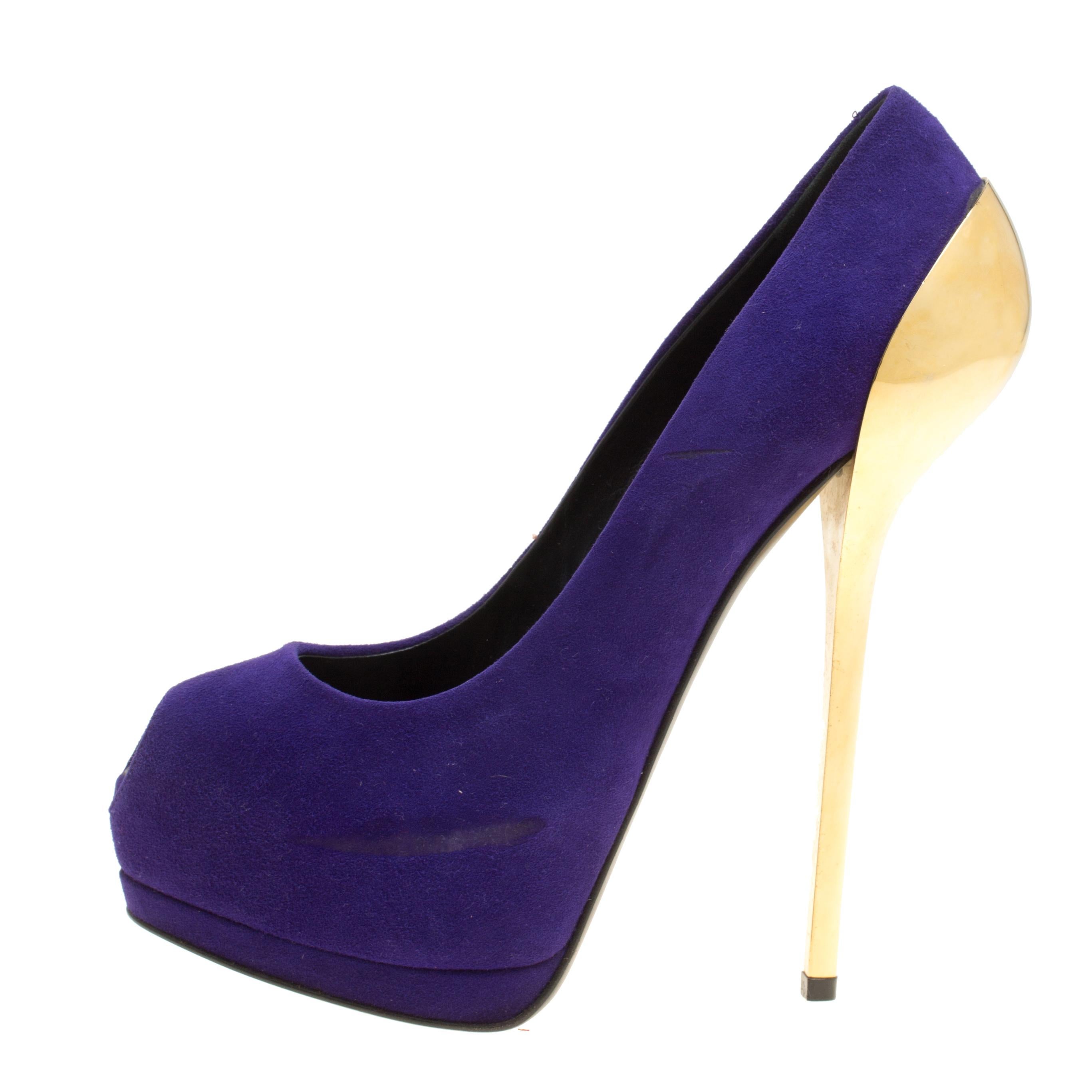 Revamp your footwear collection by adding this pair of Giuseppe Zanotti pumps to it. They are crafted from purple suede and designed with peep toes, platforms and 16.5 cm metal heels that fall from the counters.

