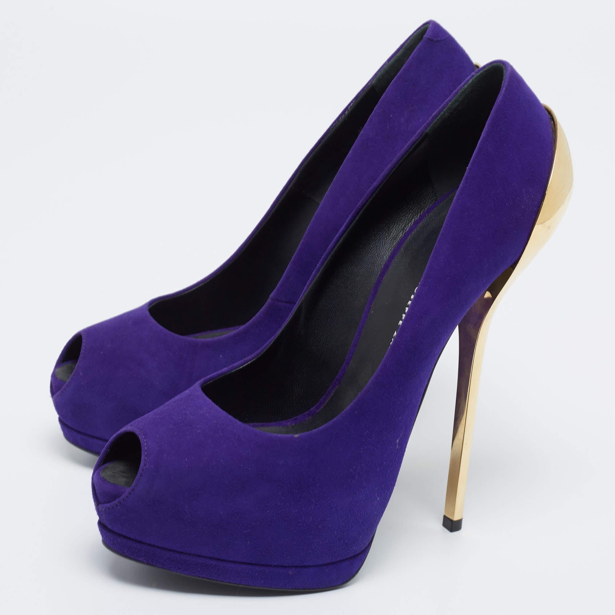 Giuseppe Zanotti yet again brings a stunning set of pumps that makes us marvel at its beauty and craftsmanship. Crafted from purple suede, these pumps are designed with tall metal heels and peep-toes.
