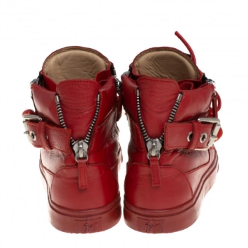 A pair that will see you through a long day in full comfort! Crafted using the finest leather, these Giuseppe Zanotti sneakers are designed in a high-top style, detailed with belted straps, lace-ups as well as zippers, and set atop durable rubber