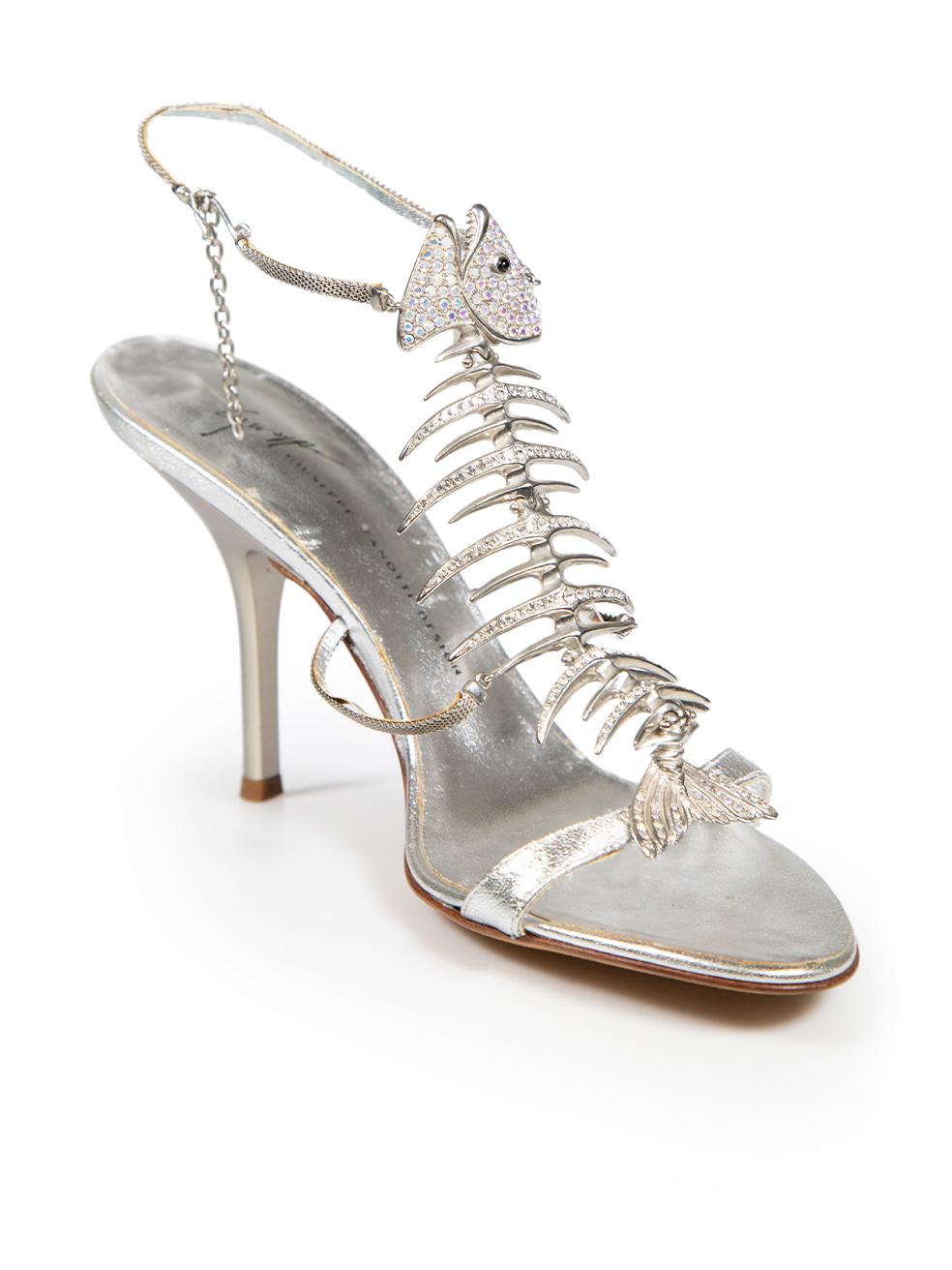 CONDITION is Very good. Minimal wear to shoes is evident. Minimal wear to both shoe heels with small indents and marks to the metal. The leather underside of both ankle straps has also started to come away from the metal exterior on this used