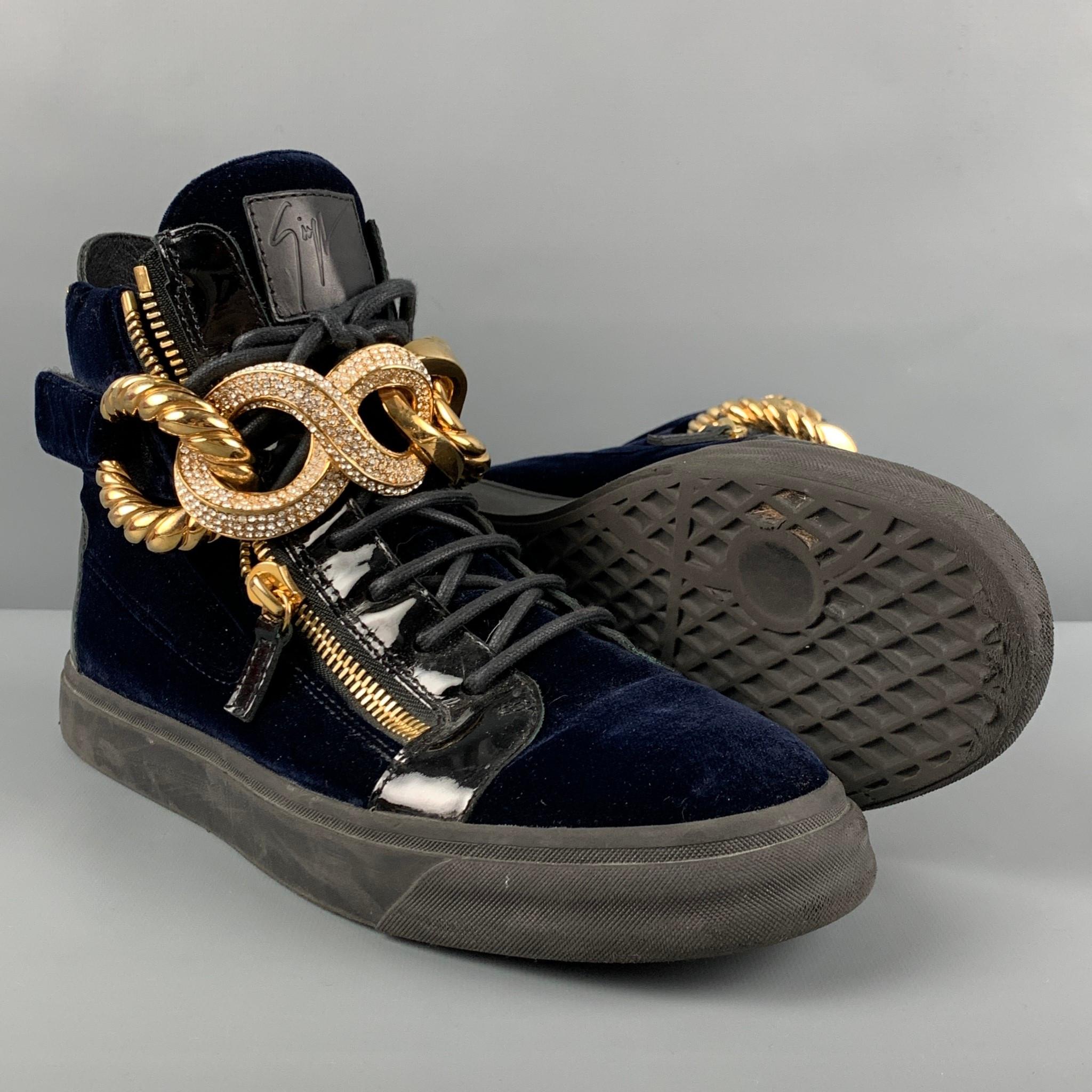 GIUSEPPE ZANOTTI sneakers comes in a navy velvet featuring a high top style, patent leather trim, oversized gold tone front chain, back zipper detail, rubber sole, and a lace up closure. Made in Italy. 

Very Good Pre-Owned Condition.
Marked: