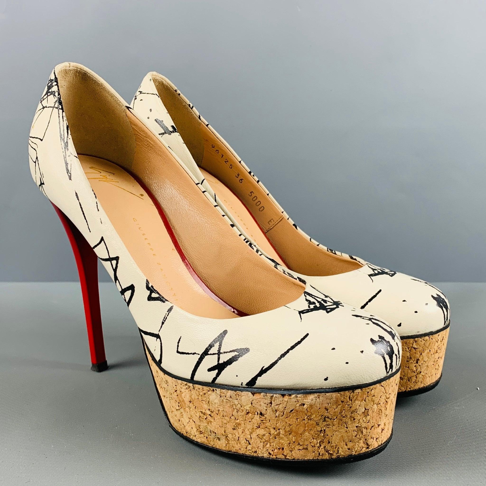 GIUSEPPE ZANOTTI pumps comes in a cream and black leather featuring a platform, red sole, and a stiletto heel. Made in Italy. Excellent Good Pre-Owned Condition.  

Marked:   96125 36 5000 E 

Measurements: 
  Heel: 5 inches Platform: 1.5 inches  
 