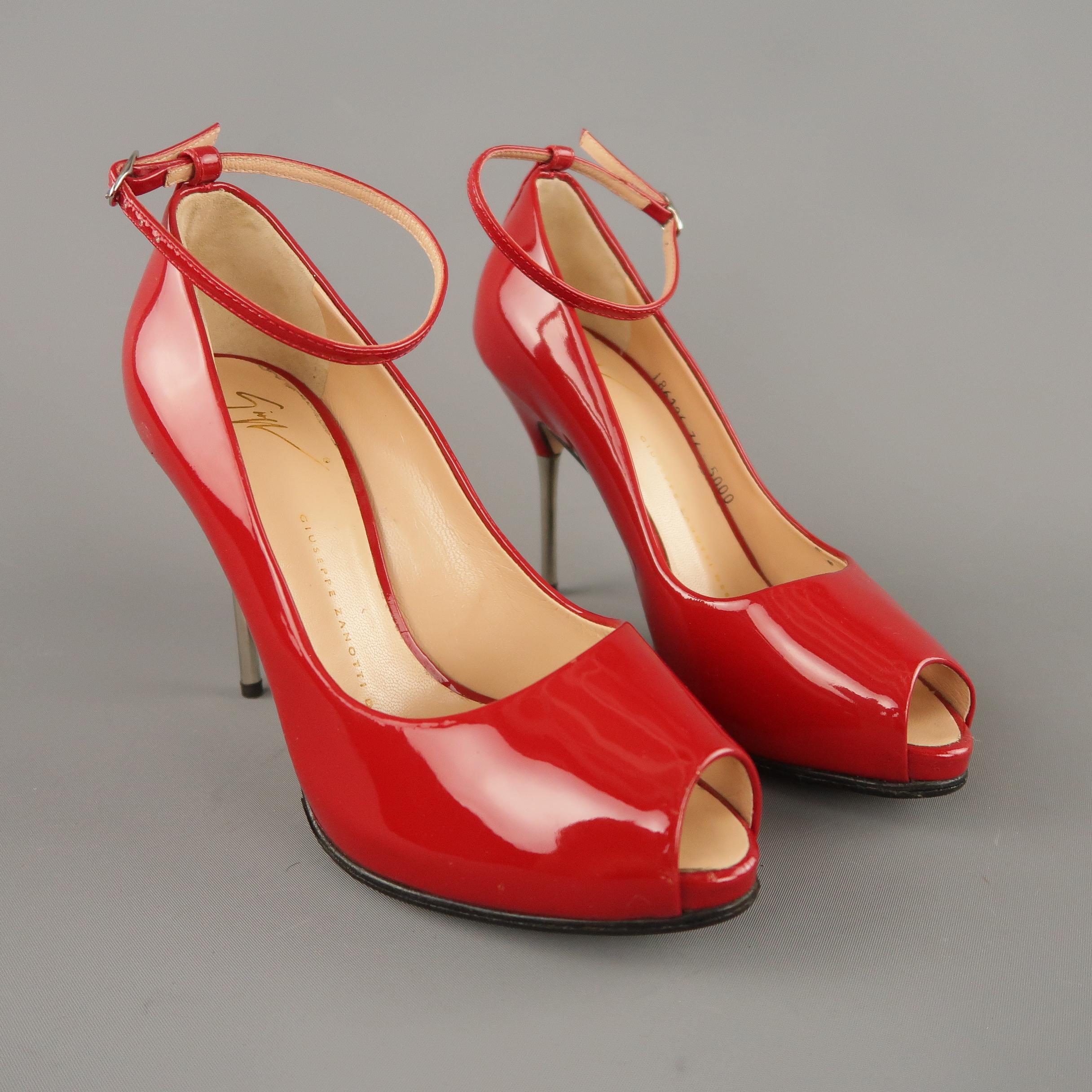 GIUSEPPE ZANOTTI pumps come in red patent leather with a concealed platform peep toe, skinny ankle strap, and silver tone metal spike heel. Made in Italy.

Original retail price $595.00
 
Excellent Pre-Owned Condition.
Marked: IT 36
 
Measurements:
