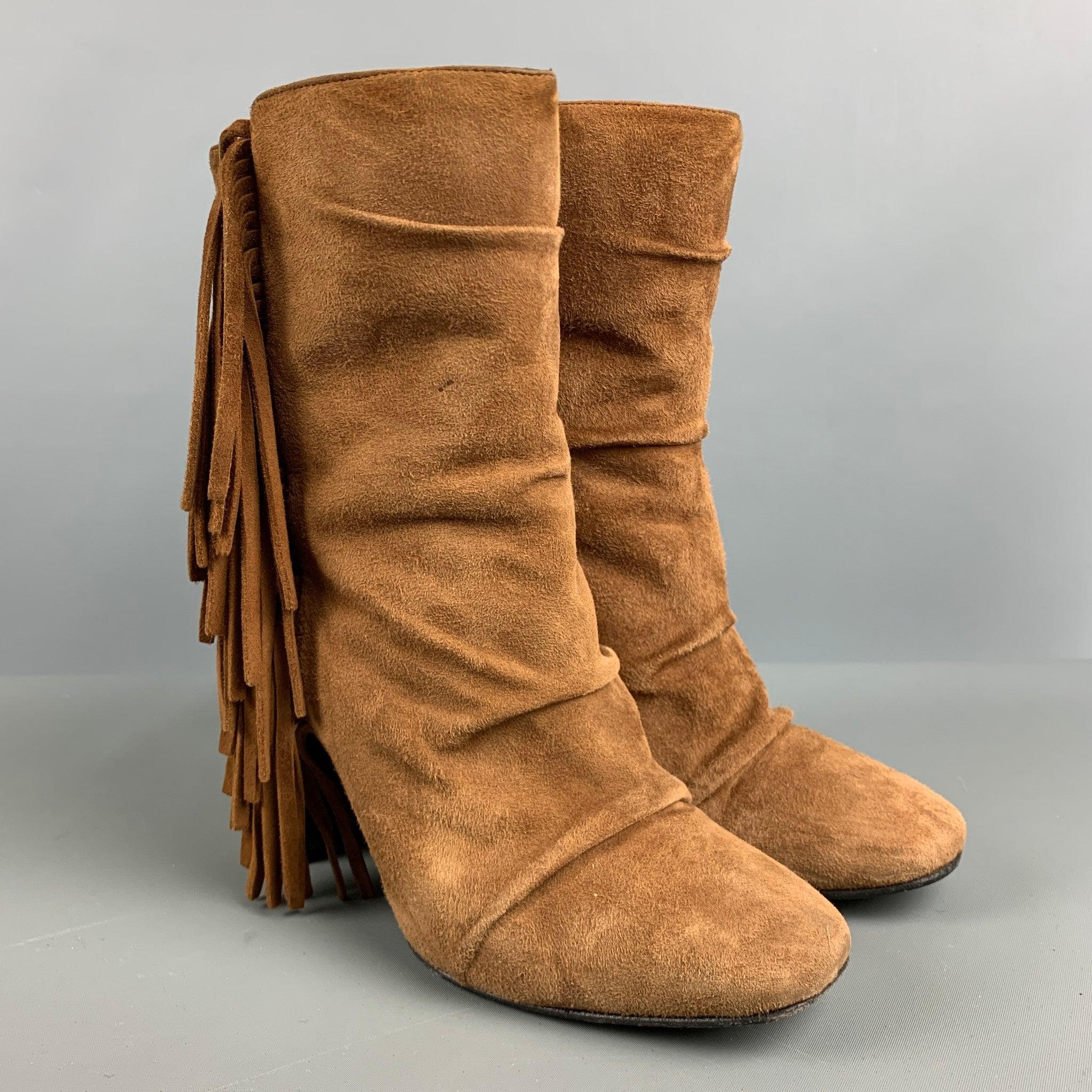 GIUSEPPE ZANOTTI boots comes in a brown suede featuring a fringe trim design and a slip on style. Made in Italy.Very Good Pre-Owned Condition. 

Marked:   S7085 37 1/2 0487 

Measurements: 
  Length: 8.5 inches Width: 3.75 inches Height: 9.25 inches