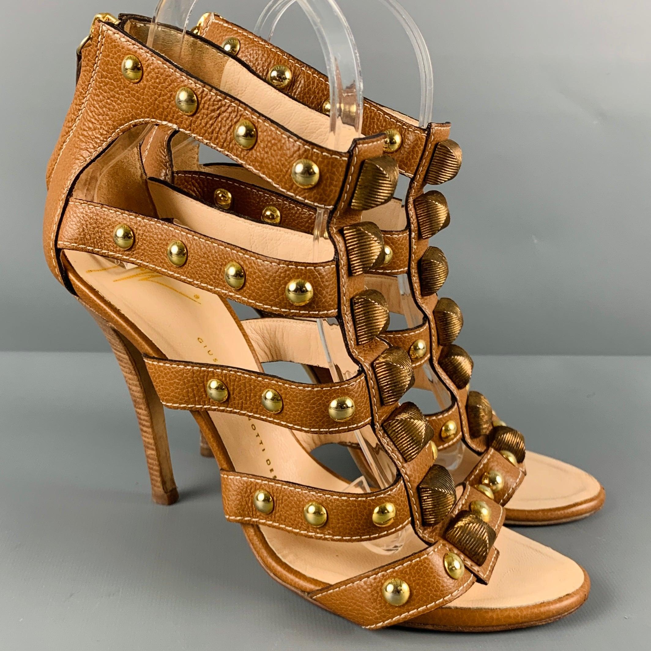GIUSEPPE ZANOTTI sandals
in a brown leather fabric featuring a gladiator style, gold tone studs, and back zipper closure. Made in Italy.Very Good Pre-Owned Condition. 

Marked:   38 

Measurements: 
  Heel: 4.5 inches 
  
  
 
Reference No.: