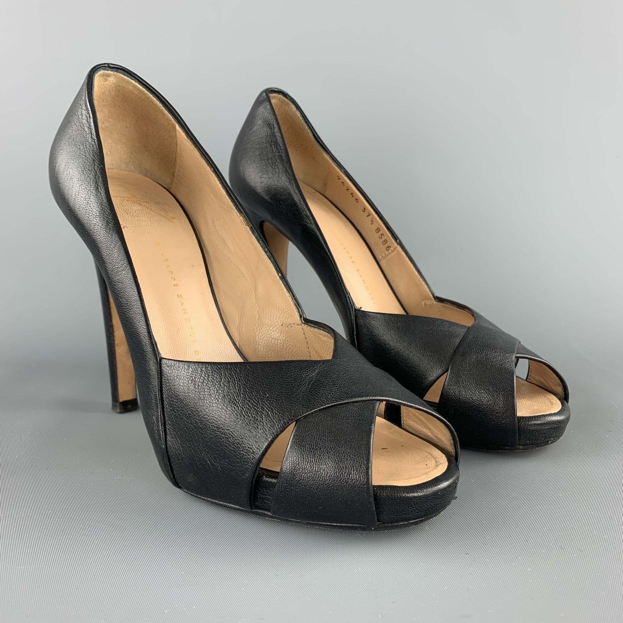 GUISEPPE ZANOTTI pumps come in black leather with a stacked heel and peep toe X strap. Made in Italy.

Excellent Pre-Owned Condition.
Marked: IT 37.5 

Heel: 4.5 in.
Platform: 0.65 in.
SKU: 103655
Category: Pumps

More Details
Brand: GIUSEPPE