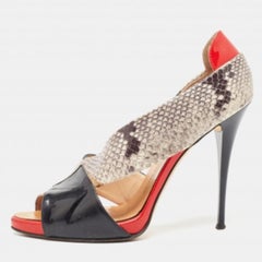 Giuseppe Zanotti Bombas D'orsay con puntera abierta de piel de serpiente y charol Talla 40.5