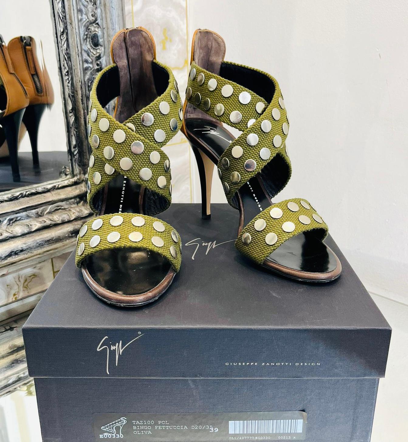 Giuseppe Zanotti Studded Sandals

Military green, open toe sandals designed with silver studs embellishment to the straps.

Featuring camel leather inserts to the heel with zipper closure.

Size – 39

Condition – Very Good

Composition –