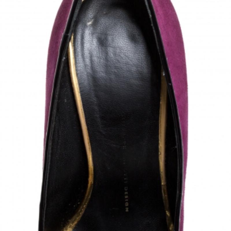 Brimming with unparalleled sophistication, these gorgeous purple pumps from Giuseppe Zanotti are ready to help you fashion a statement look. Crafted from suede and flaunting a peep-toe silhouette, these pumps exhibit crystal embellishments on the