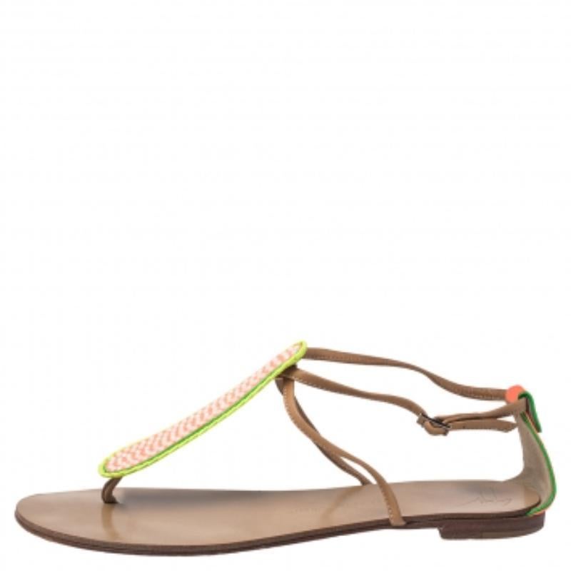 These Giuseppe Zanotti sandals are perfect for the summertime! Crafted from leather, they feature thong straps at their fronts that are embellished with glitter, buckled ankle straps and Giuseppe Zanotti labelled insoles. Pair these tricolored