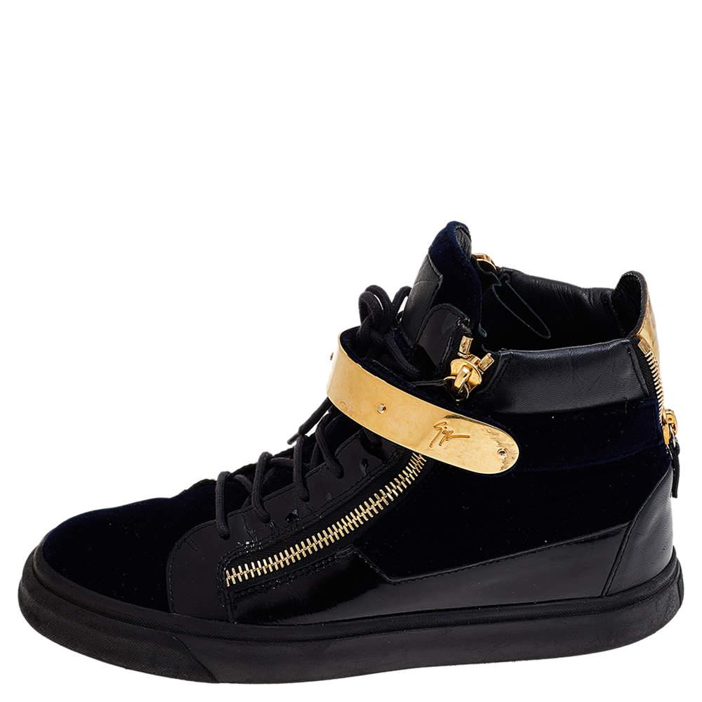 Bring home the luxurious high-fashion touch with these sneakers from Giuseppe Zanotti. Crafted from leather and velvet, these sneakers come flaunting fine details like the gold velcro strap, the lace-up, and zippers. You wouldn't want to miss out on