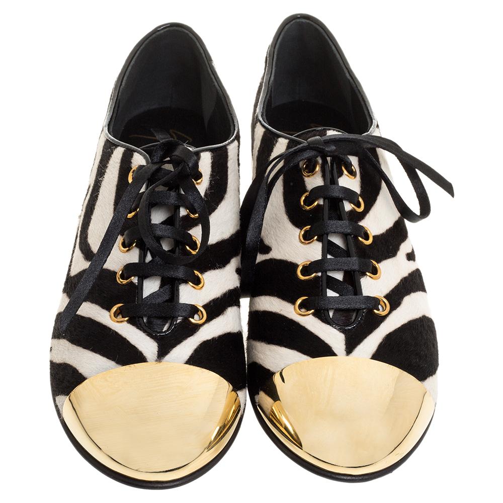 Oxfords never look so stylish, thanks to these ones from Giuseppe Zanotti! They are crafted from zebra printed pony hair and styled with gold-tone metal cap toes and lace-ups on the vamps. They are equipped with comfortable leather-lined insoles and