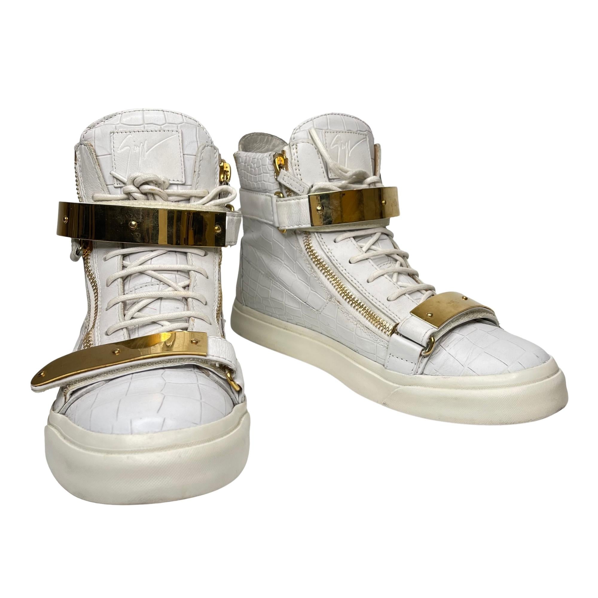 Made from croc-embossed leather, these sneakers come flaunting suave details like the double metal straps, the lace-up, and the zipper details. RDM309.

COLOR: White
MATERIAL: Croc embossed leather
SIZE: 44 EU / 11 US
COMES WITH: Dust bag and