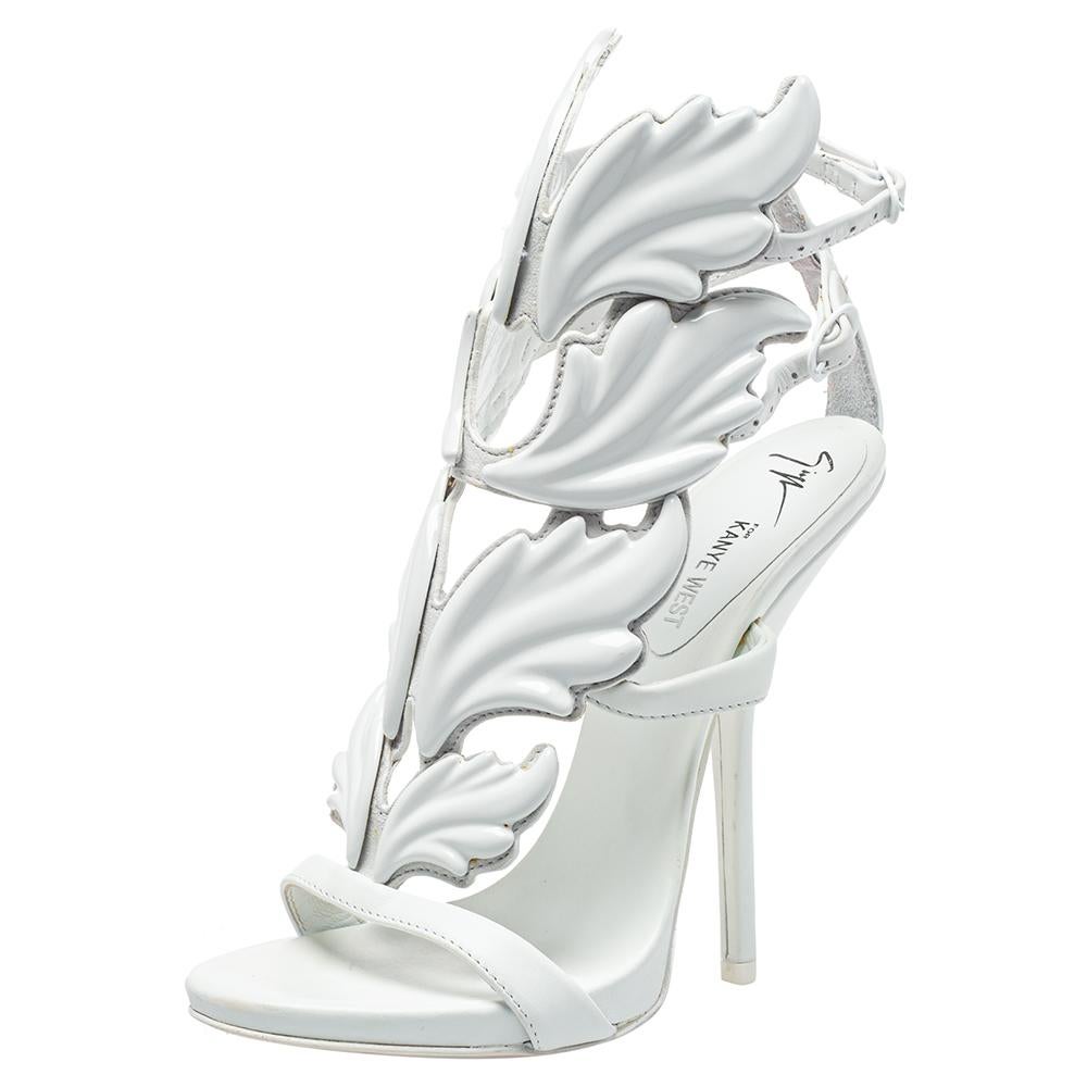 Breathtakingly beautiful, these pristine white Kanye West x Giuseppe Zanotti sandals are sure to take your breath away! The Cruel sandals have been crafted from leather into an open-toe silhouette and designed with wings. They are equipped with