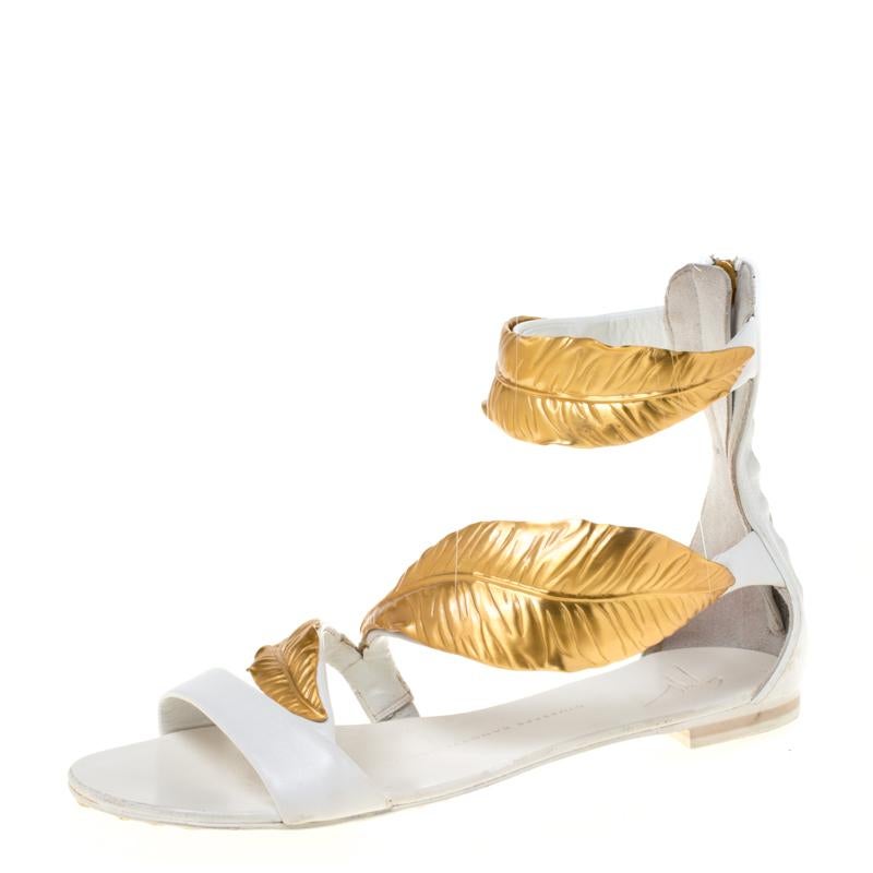 How can one not fall in love with these sandals by Giuseppe Zanotti! They have been beautifully crafted from leather and detailed with gold-tone metal leaf embellishments. The sandals carry comfortable insoles and zippers on the counters.

Includes: