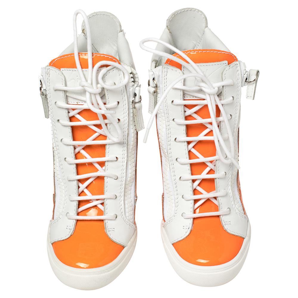 Comfort comes wrapped in these sneakers from Giuseppe Zanotti. They are crafted from leather and they bring details of lace-ups and zippers. Elevated on wedge heels, these sneakers are easy to wear all day without compromising on style.

Includes:
