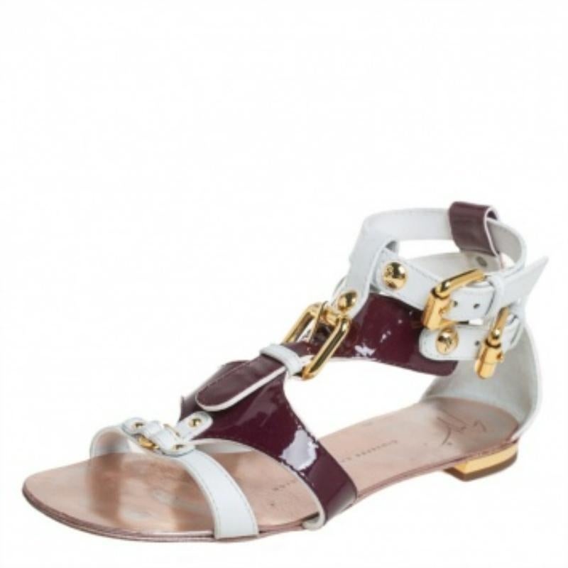 Giuseppe Zanotti is one of the leading names when it comes to a pair of gorgeous sandals like this one. These patent leather and leather sandals are a high-end fashion item that you need to own now. Lined with strong and durable leather, these white