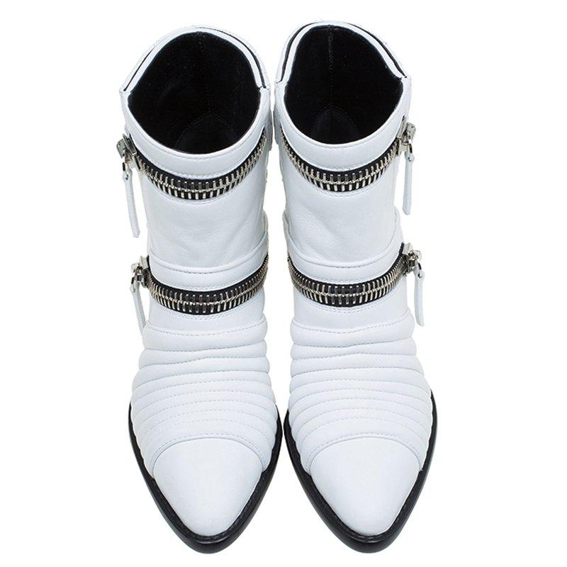 Zanotti is constantly pushing the boundaries of existing aesthetic styles to give his patrons, new and fresh designs. These ankle boots accurately reflect this philosophy with their white leather exterior accented by quilted detailing at the vamp