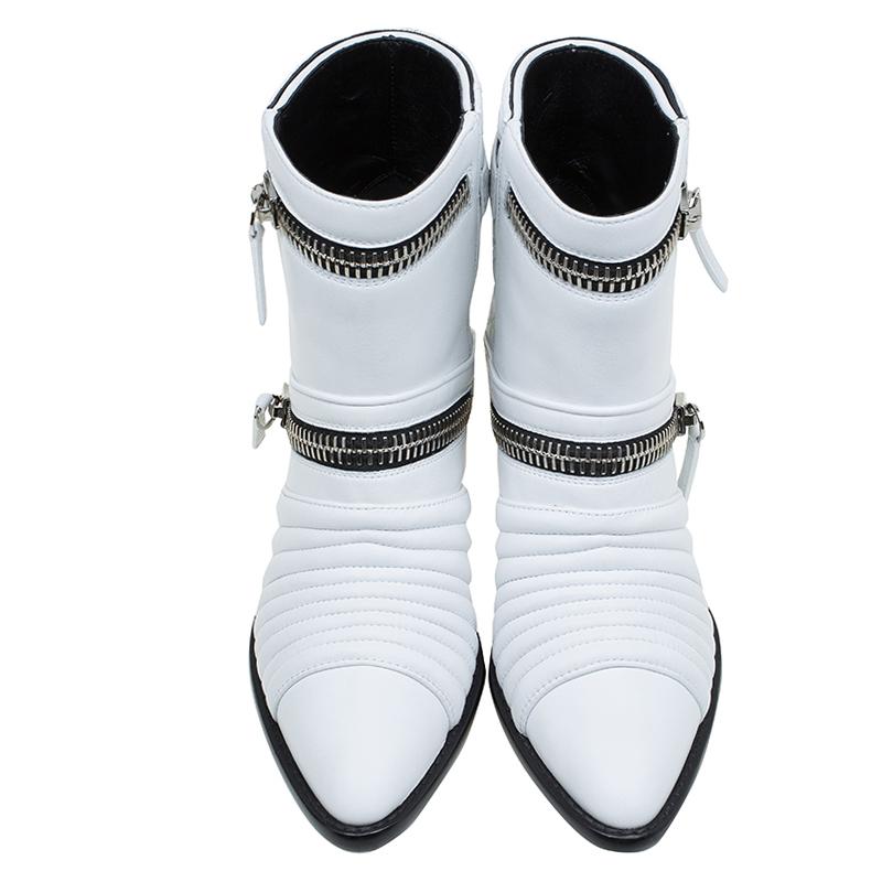Characterised by their quilted detailing, these shoes from Giuseppe Zanotti have pristine white leather uppers. Designed as ankle boots, they feature zip detailing on the front with pointed toe caps. Elevated by wedge heels, this refined design is