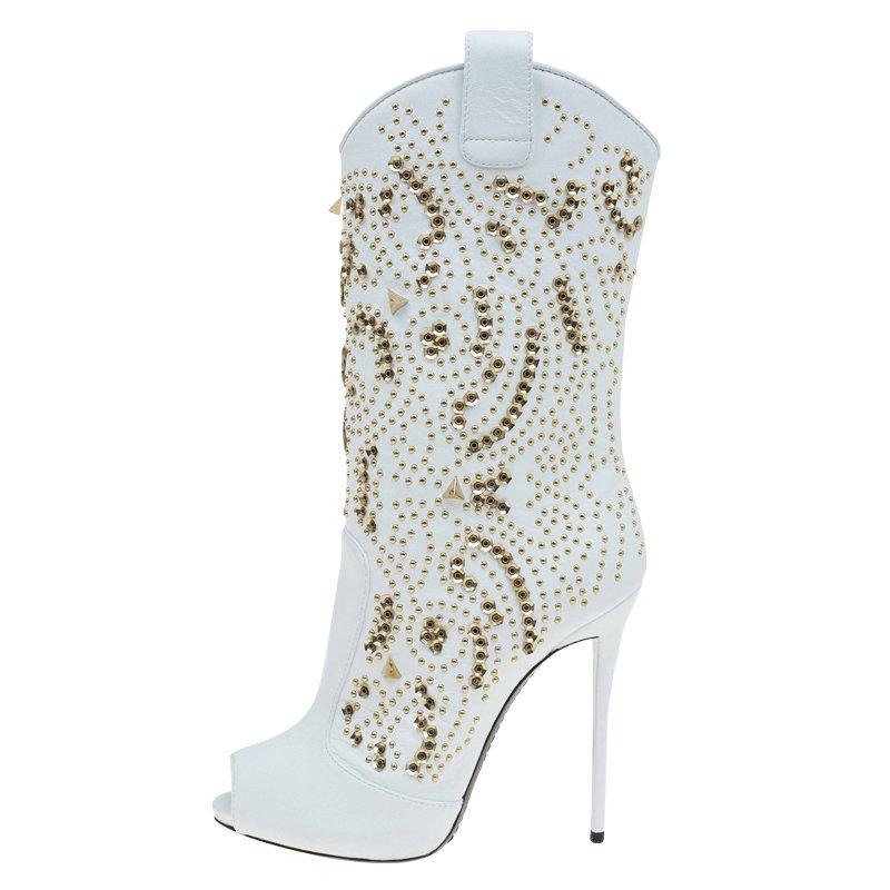 Your inner cowgirl is going to be delighted by this Giuseppe Zanotti creation. It has been crafted from 100 percent genuine leather that is snowy white in color. Gorgeously studded with gold studs, these midcalf boots have peep toes and are perfect