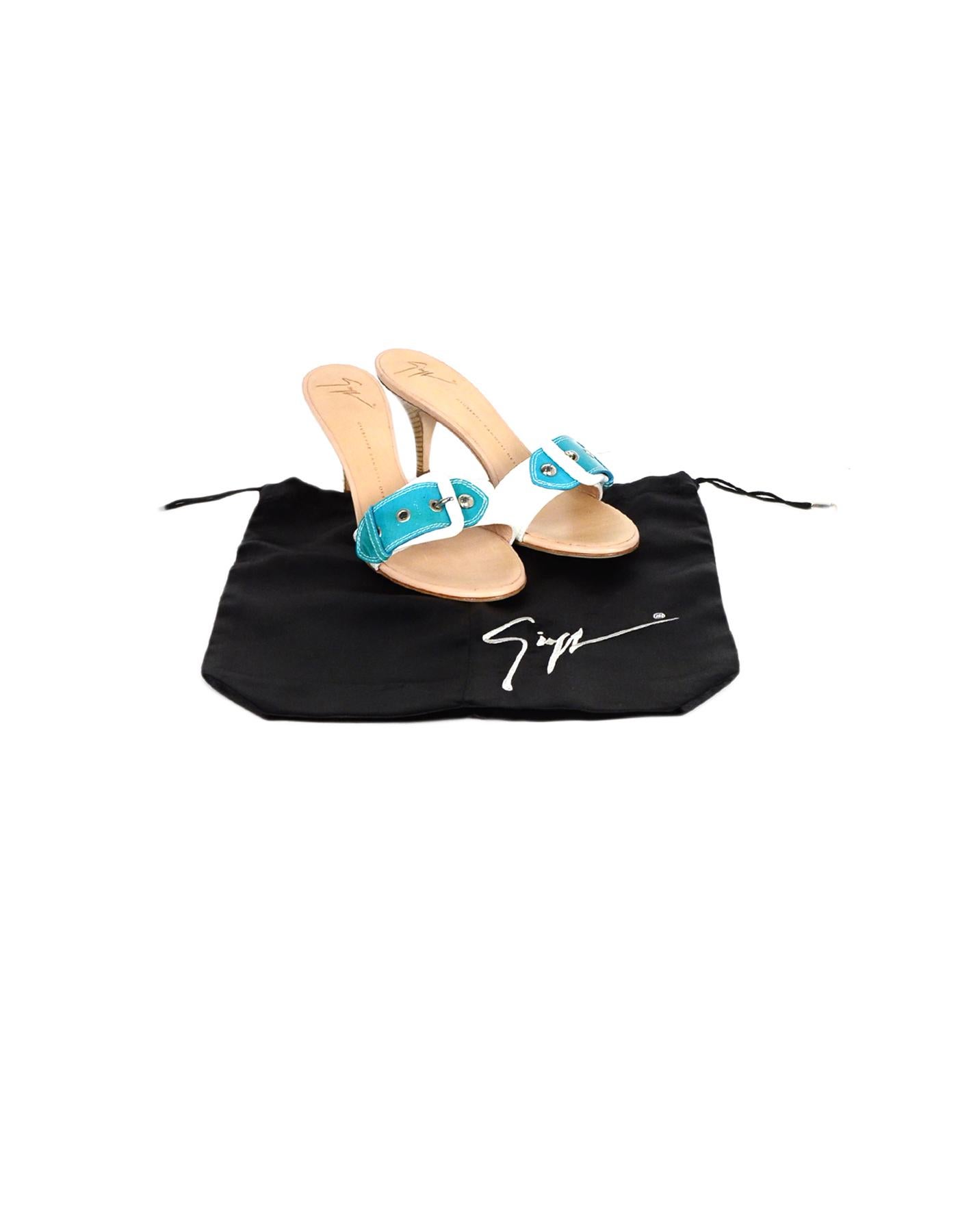 Giuseppe Zanotti White/Turquoise Patent Buckle Mules sz 39

Made In: Italy
Color: White, turquoise
Hardware: Silvertone hardware
Materials: Patent leather
Closure/Opening: Slide on
Overall Condition: Excellent pre-owned condition, with minor wear to