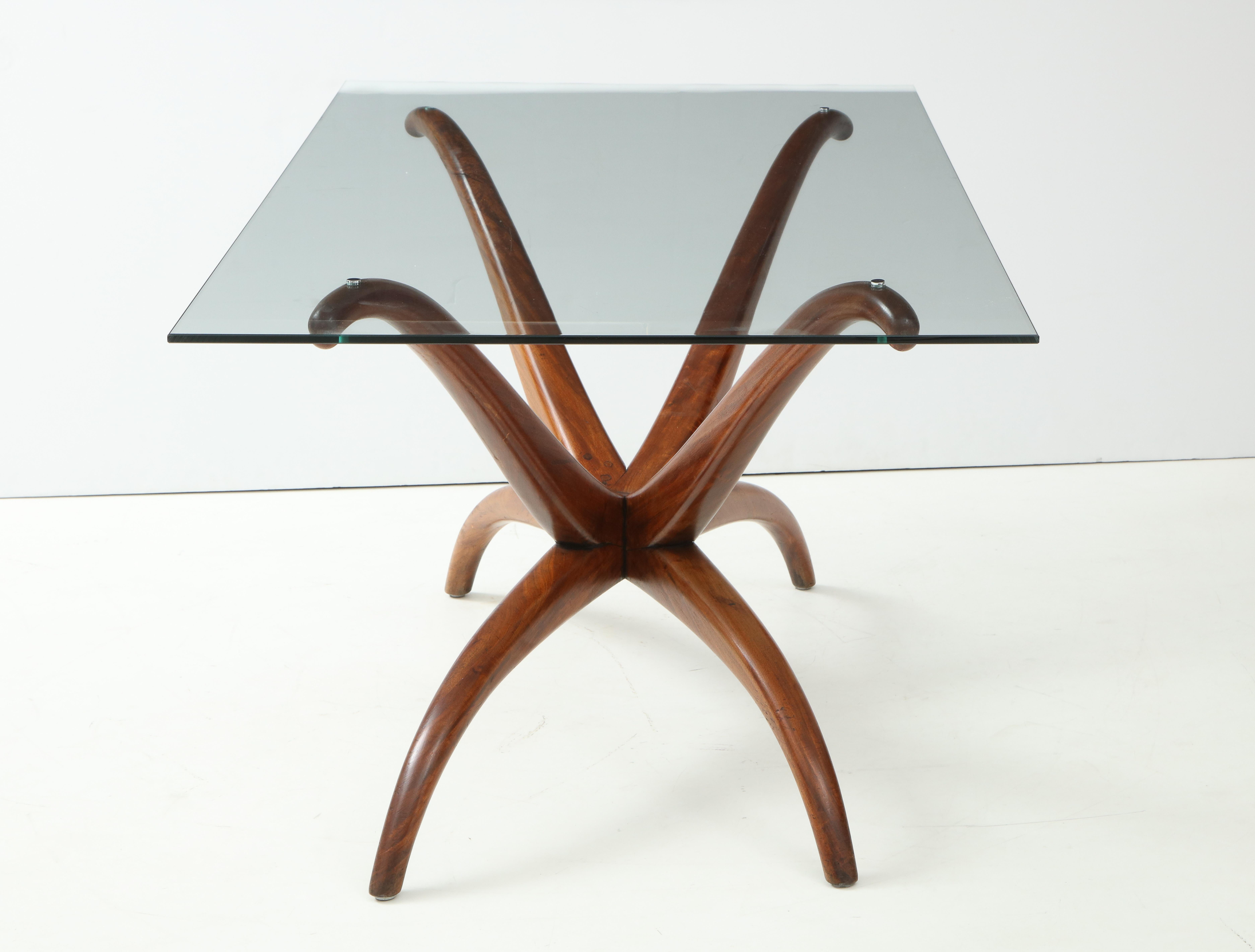 A rare and important 1950s sculptural walnut wood table
By Brazilian mid century master, Giuseppi Scapinelli. The glass top is fitted down into the base with cap screws. Original condition, 
Provenance: Estate of Elie
