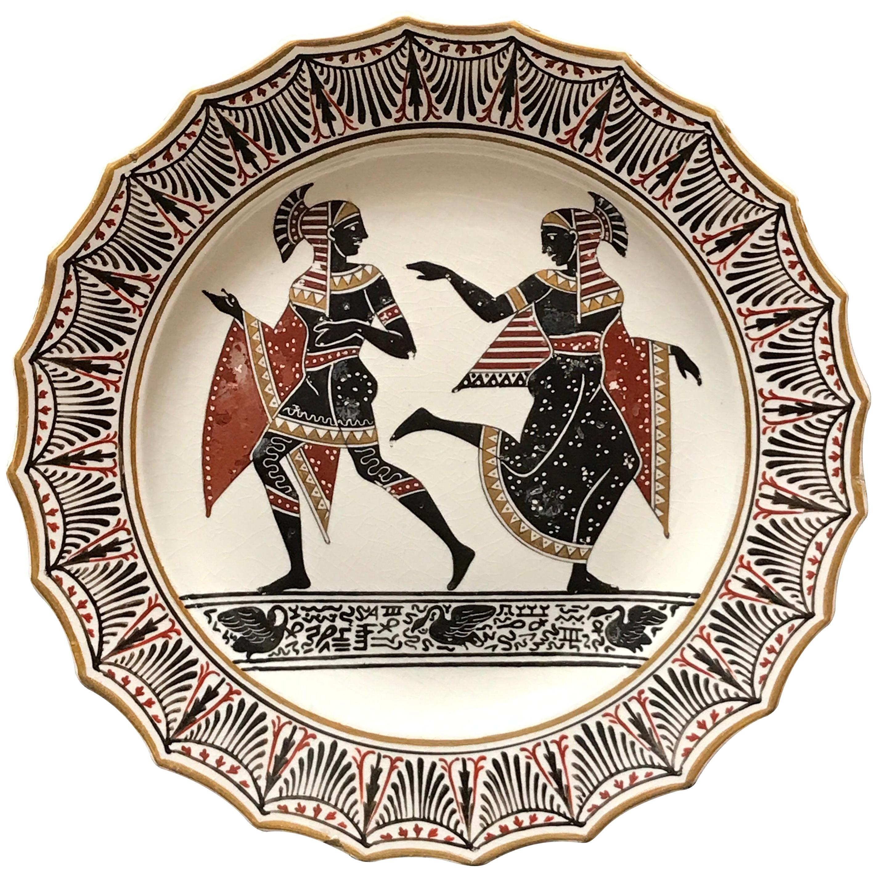 Assiette en poterie Giustiniani Egyptomania avec rehauts dorés, forme de cygne à gauche