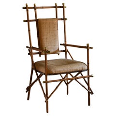 Vintage Giusto Puri Purini rattan armchair with brass details and rattan fabric cushions