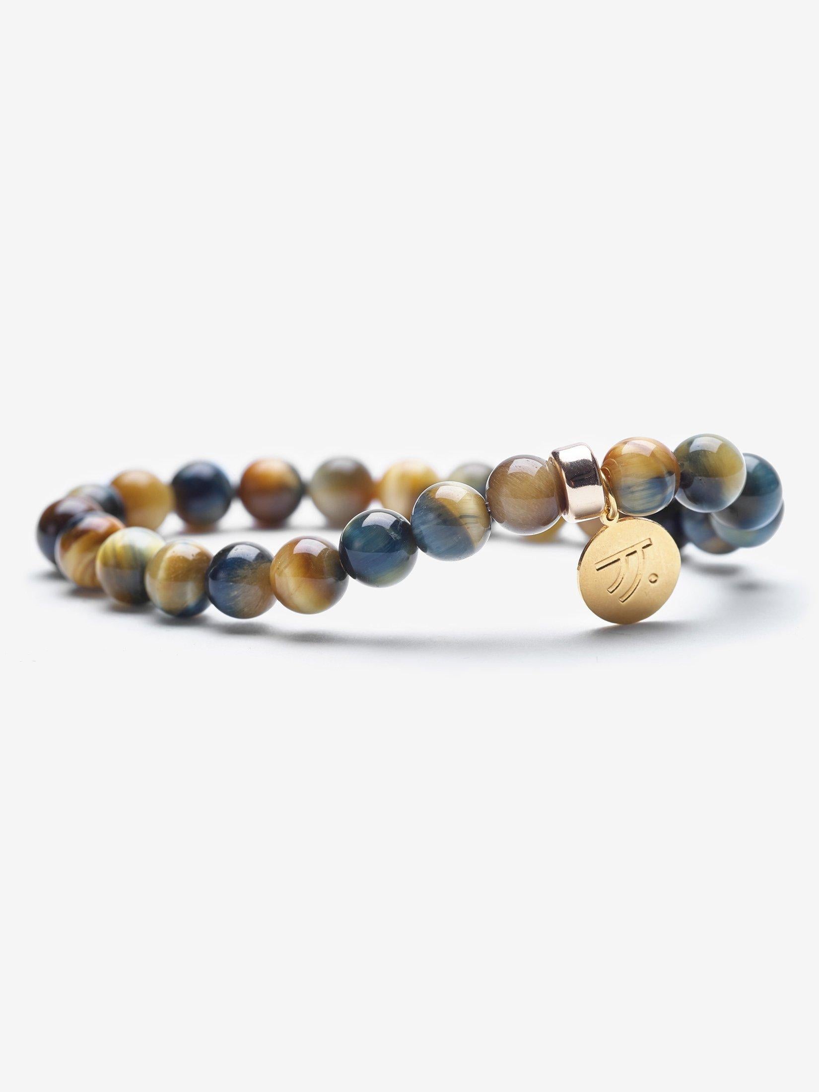 Yellow blue tiger's eye is a mesmerizing stone filled with rich hues of golden yellow and midnight blue. The golden honey colors and deep blue represent courage.  Tiger's eye is a stone of protection.

Materials
Golden Blue Tiger's Eye, 14K Gold