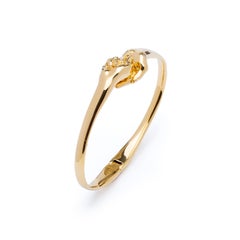 Pulsera brazalete de oro amarillo de 18 quilates "Give & Receive" de Lorenzo Quinn