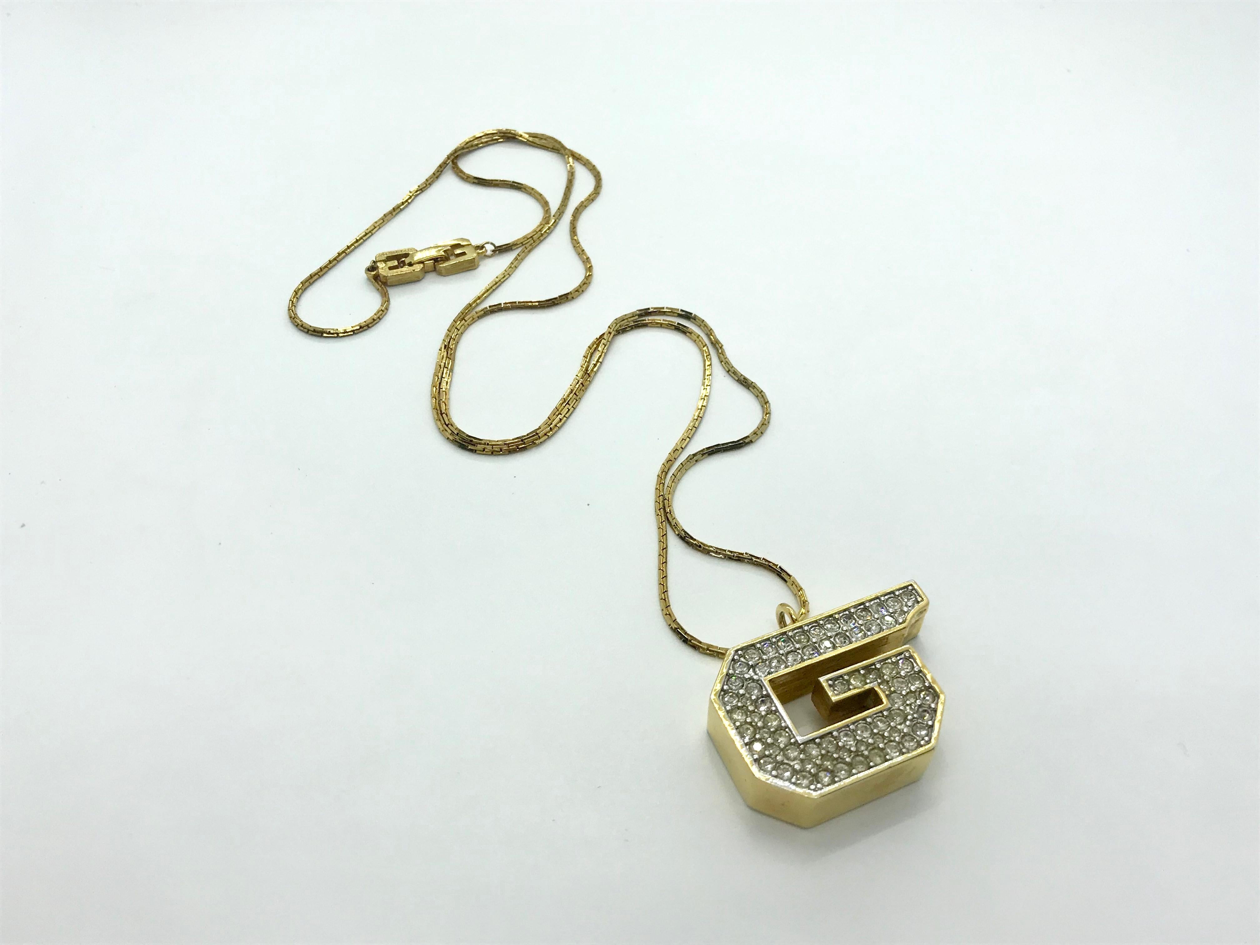 Amazing and super rare Givenchy 1970s Whistle Crystal Pendant Necklace.  Signed on reverse.  Made in 1979. Major Studio 54 vibes.

Excellent condition overall, some minor wear to metal in keeping with age.  Whistle in perfect working order.  Rave