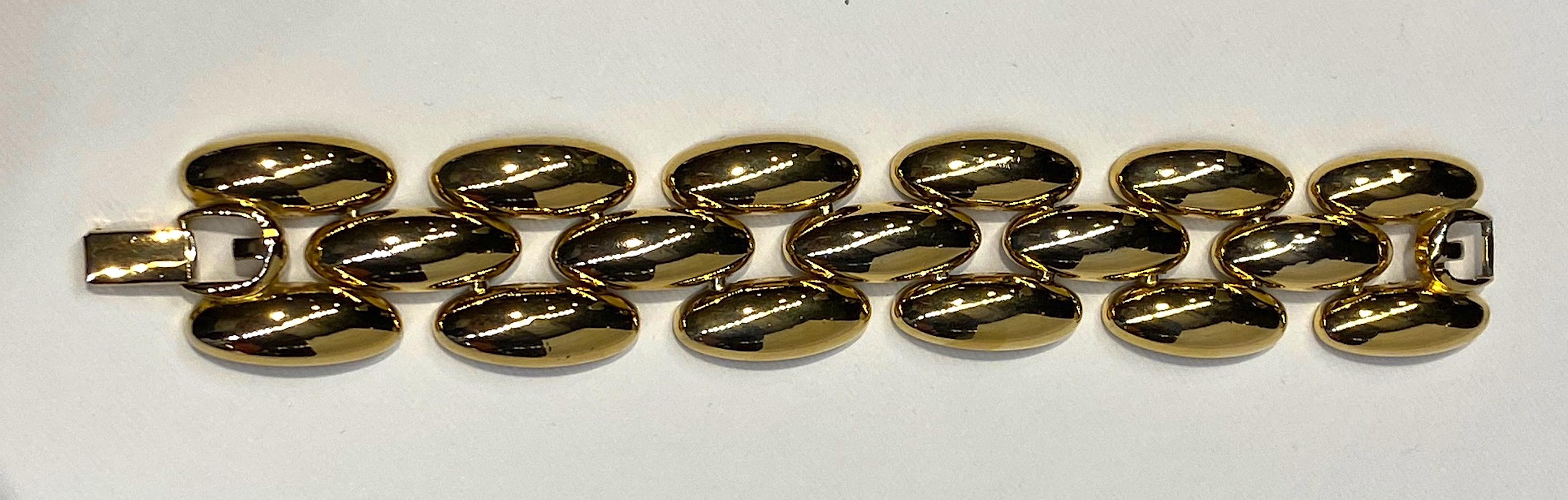 A classic wide oval link 1980s bracelet by French fashion house Givenchy. The bracelet measures 1.13 inches wide and 7.25 inches long with a wearable length of 7 inches. There are six double oval links connected by the middle 6 single oval links.