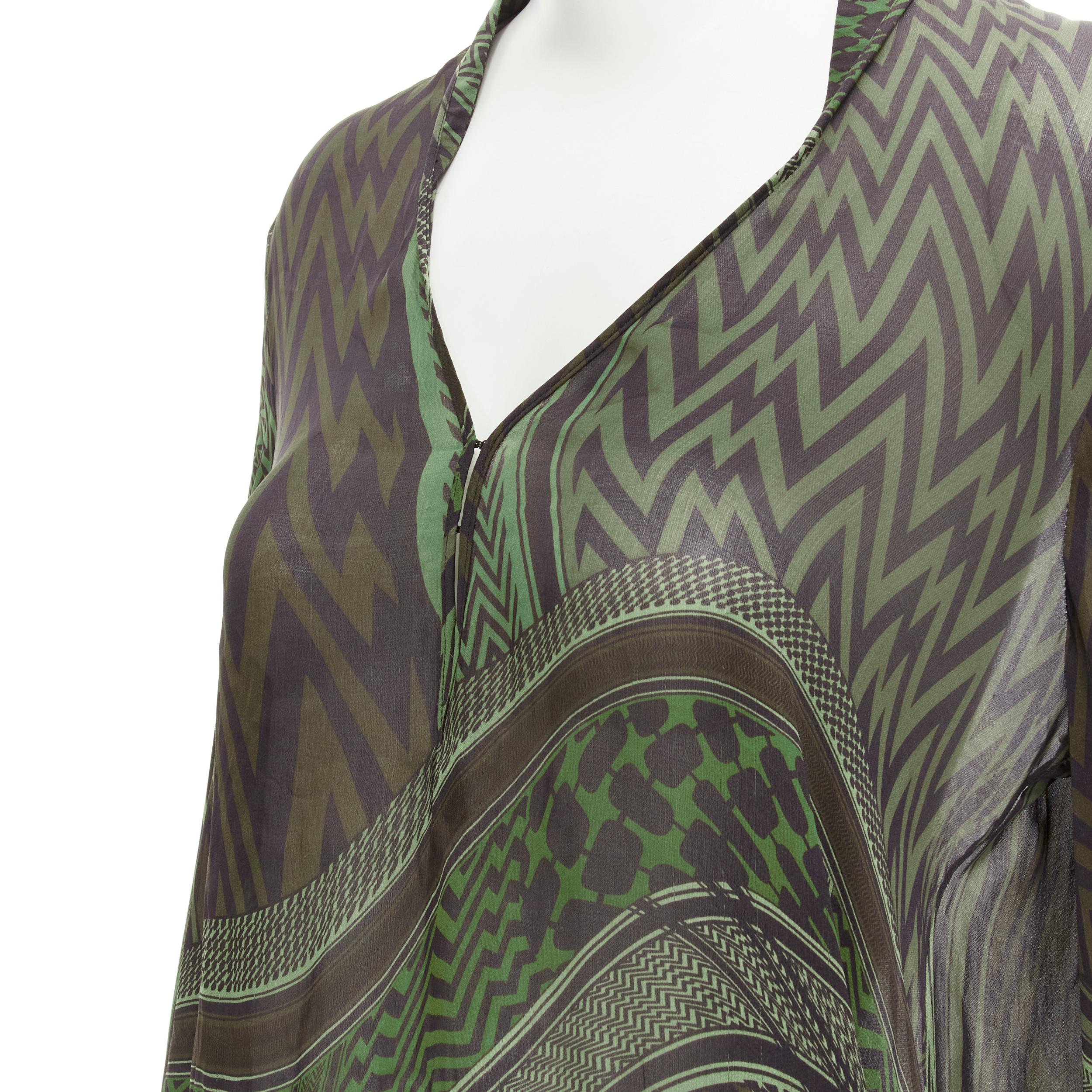 GIVENCHY 2010 Tisci 100% silk green geometric print tie sleeve blouse FR40 M 
Reference: AEMA/A00086 
Brand: Givenchy 
Designer: Riccardo Tisci 
Collection: Spring Summer 2010 
Material: Silk 
Color: Green 
Pattern: Geometric 
Closure: Hook & Eye