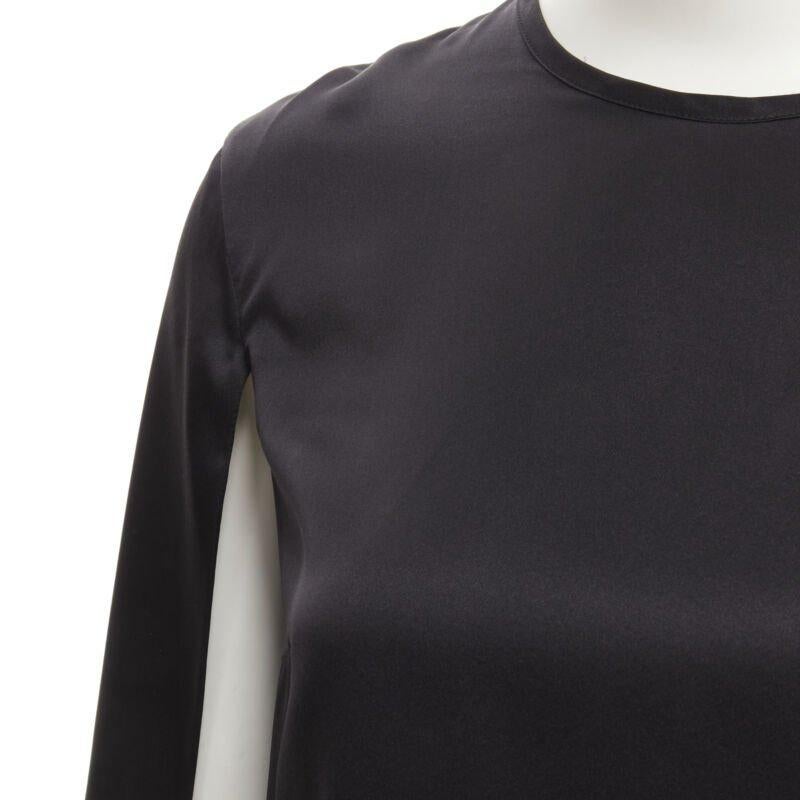 GIVENCHY 2015 Riccardo Tisci 100% silk black cape slit sleeve top FR34 XS
Reference: KEDG/A00088
Brand: Givenchy
Designer: Riccardo Tisci
Collection: 2015 - Runway
Material: Silk
Color: Black
Pattern: Solid
Closure: Button
Extra Details: Keyhole