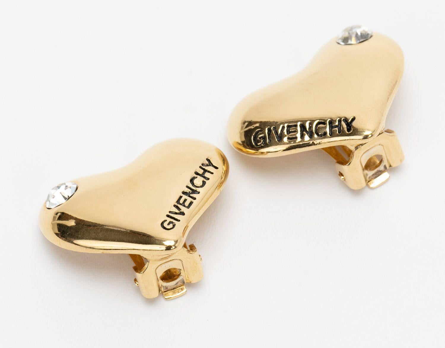Givenchy Heart Clip Ons in Gold with a Rhinestone and the Givenchy logo. In excellent condition.