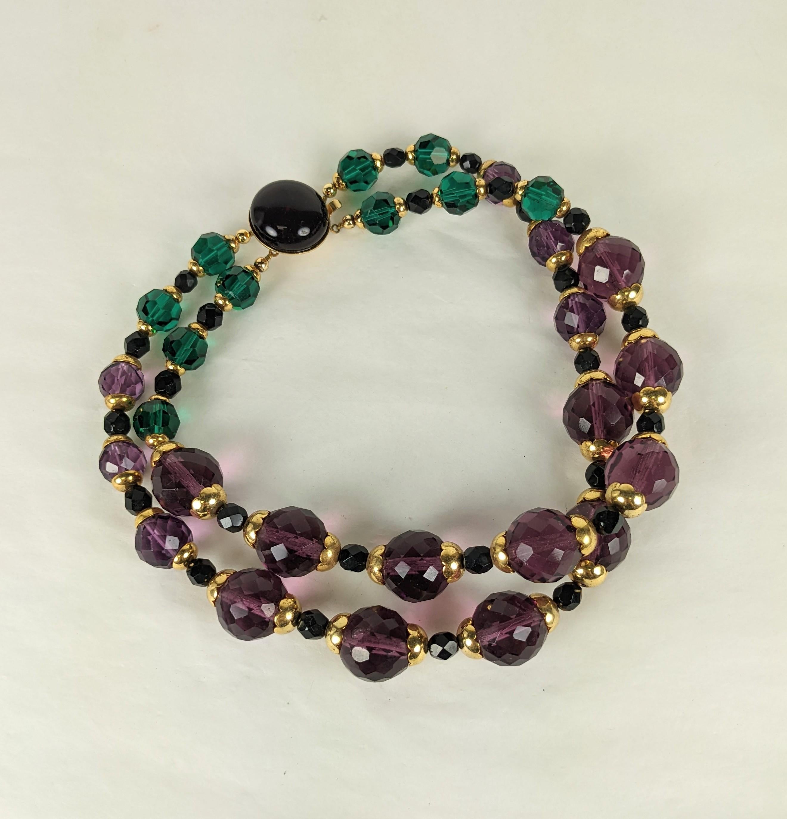 Hubert de Givenchy Haute Couture gilt metal, faux faceted amythest, emerald crystals and jet two strand choker from the estate of Bunny Mellon. Made in France.
Unsigned Haute Couture, Very Small size. Excellent Condition.  
L 14.75