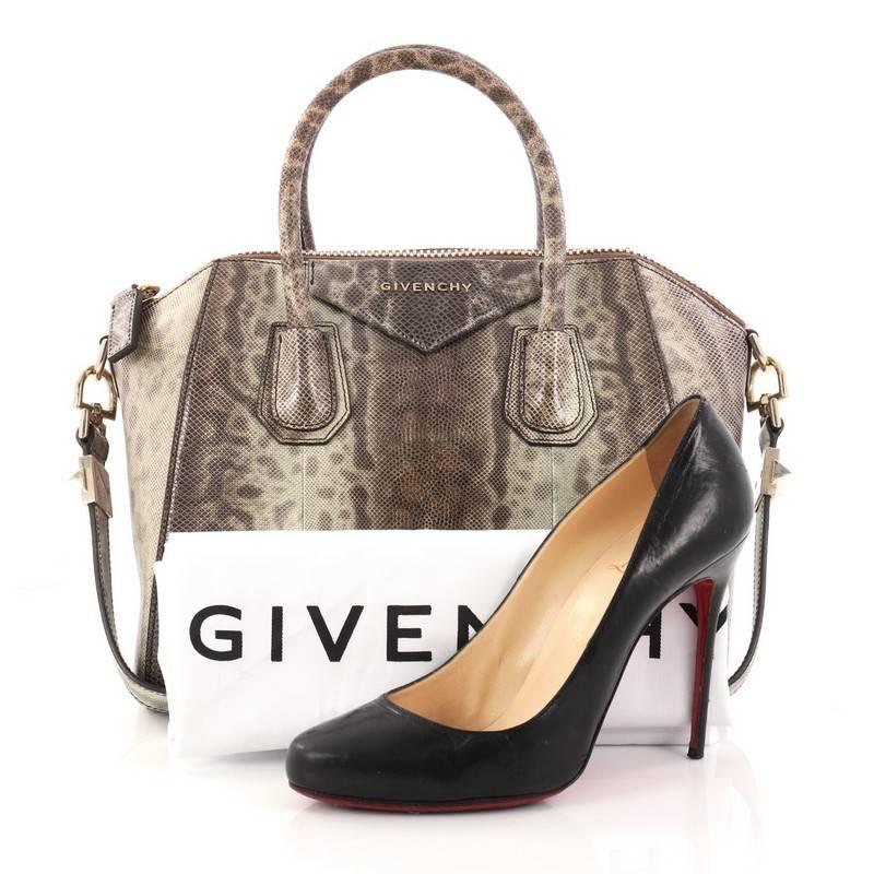 This authentic Givenchy Antigona Bag Snakeskin Small is a go-to fashion favorite with an exotic twist. Crafted from genuine brown snakeskin, this structured yet stylish tote features the brand's signature envelope flap detail with silver Givenchy