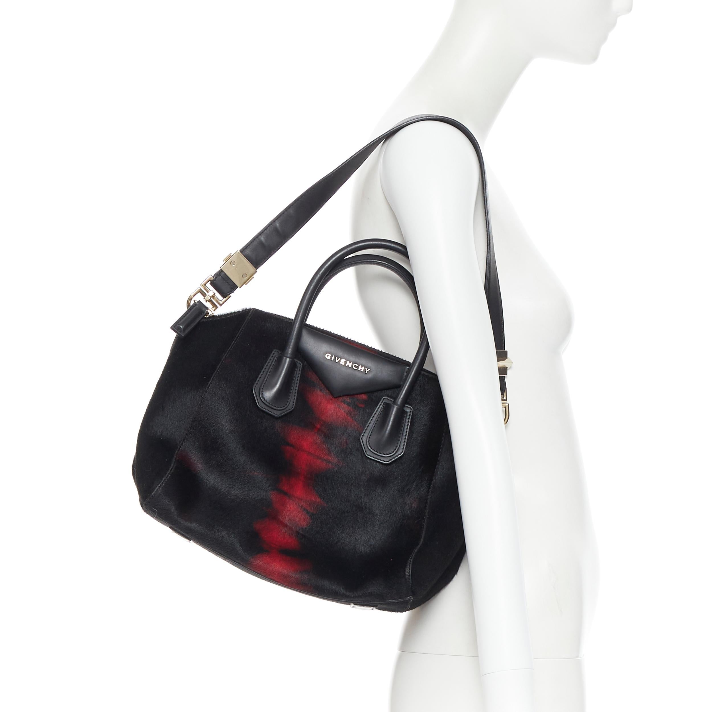 GIVENCHY Antigona black red pony hair gold hardware top zip shoulder tote bag Reference: CAWG/A00169 
Brand: Givenchy 
Designer: Riccardo Tisci 
Model: Antigona 
Material: Leather 
Color: Black 
Pattern: Abstract 
Closure: Zip 
Extra Detail: