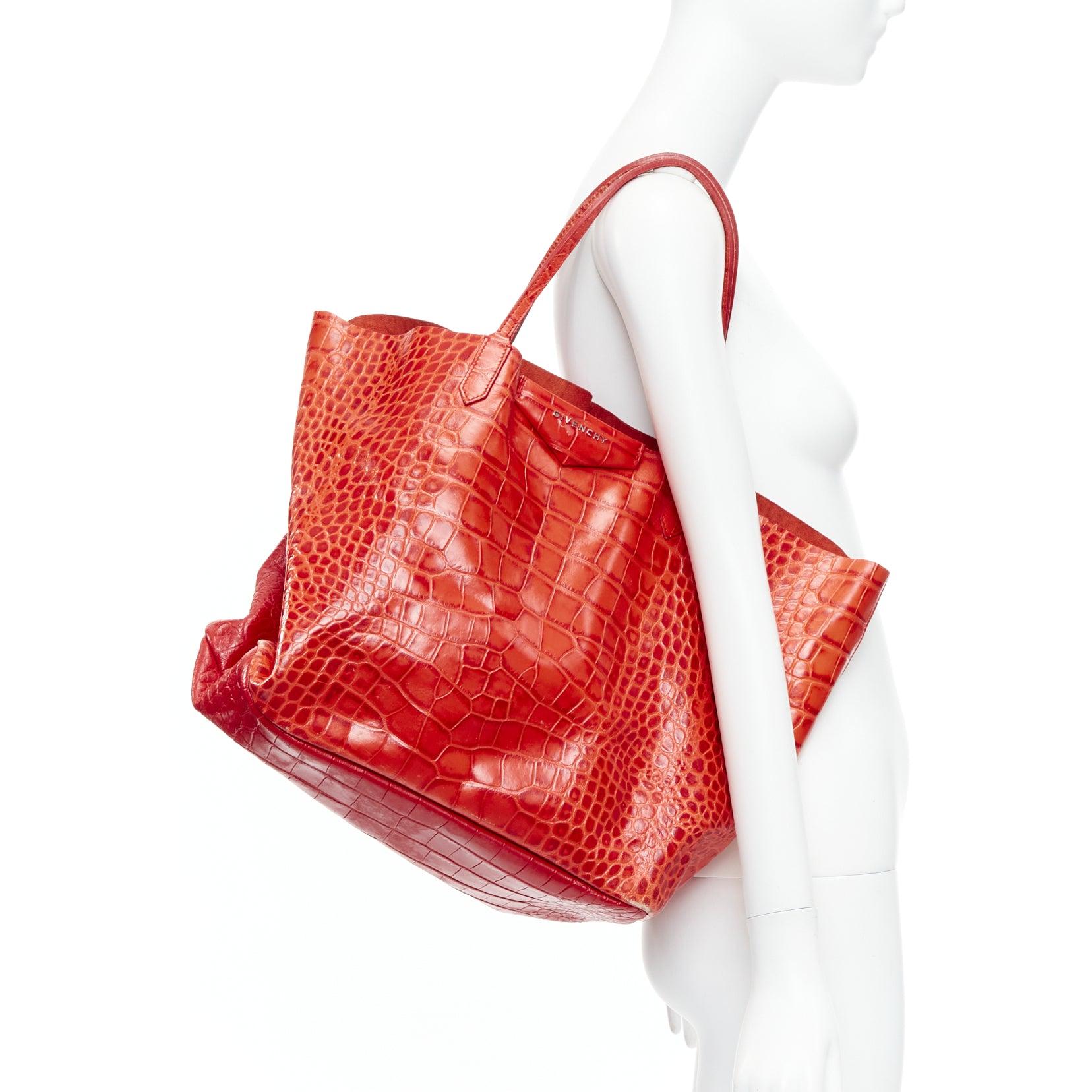 GIVENCHY Antigona red stamped scaled leather silver logo tote bag
Reference: CNPG/A00078
Brand: Givenchy
Designer: Riccardo Tisci
Model: Antigona
Material: Leather
Color: Red
Pattern: Animal Print
Lining: Red Leather

CONDITION:
Condition: Fair,