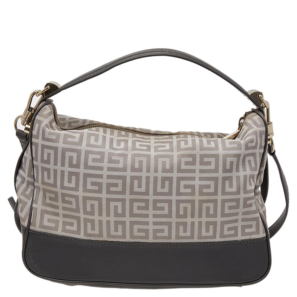 Add a signature touch to your collection of accessories with this Givenchy hobo bag. It is made from the brand's monogram canvas and leather. It comes in lovely hues of beige and grey. It is styled with a single handle, canvas interior with a zip