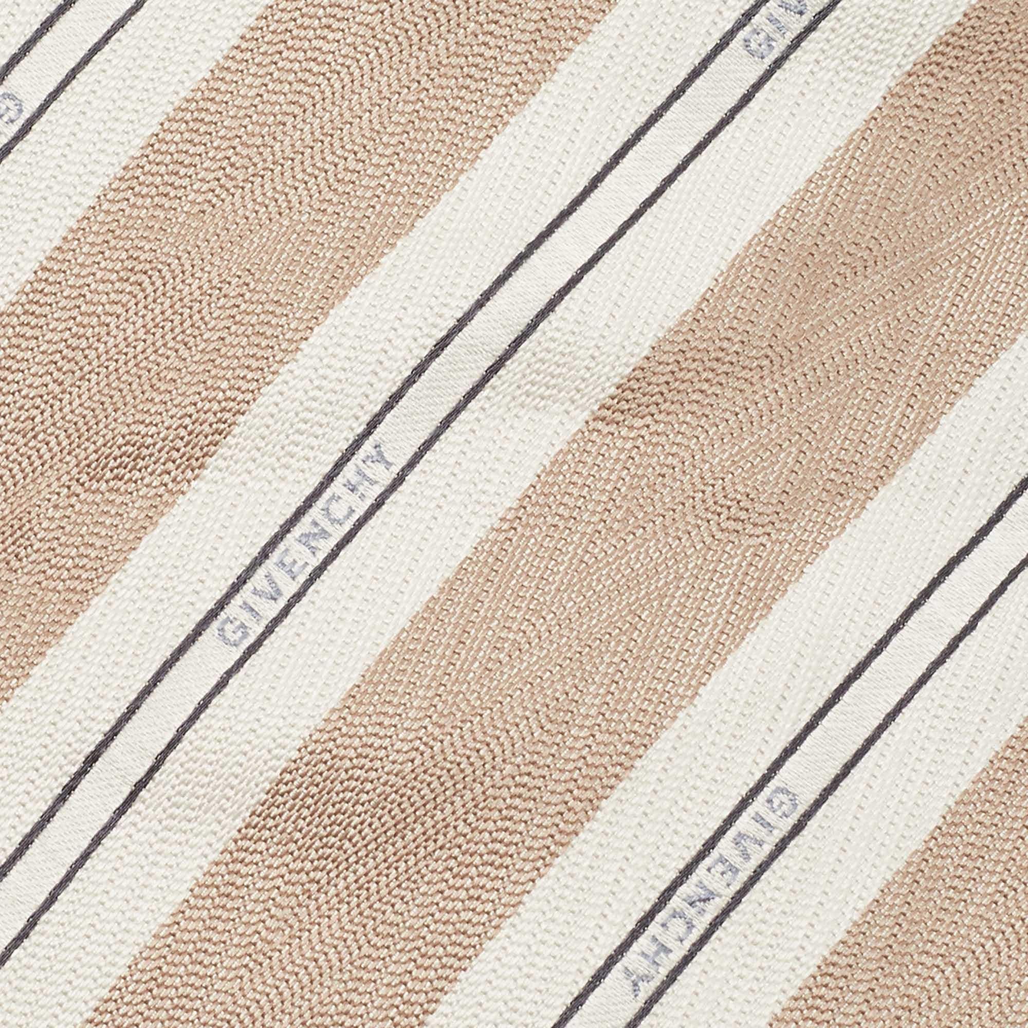 This tie is a perfect formal accessory that has a sharp and modern appeal. Made from luxurious materials  it features intricate patterns  and the brand label neatly stitched at the back. It is sure to add oodles of style to your blazers.
