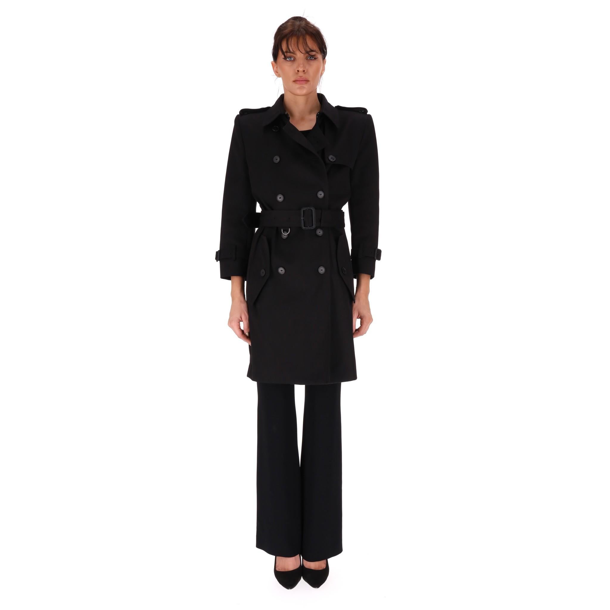 Givenchy Belted Cotton Trench Coat
Black, above the knee traditional  style trench coat with belted waist and shoulder epaulettes.

Size - 36FR

Condition - Very Good

Composition - Cotton 
