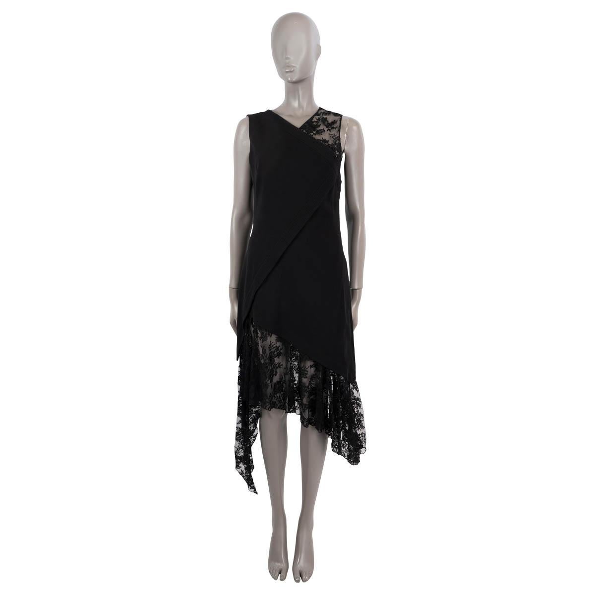 This 100% authentic Givenchy asymmetric cocktail dress combines black wool (100%) with delicate lace crafted from cotton (68%) and polyamide (32%) for a striking contrast. It opens with a discreet hook and concealed zip on the side, and is fully
