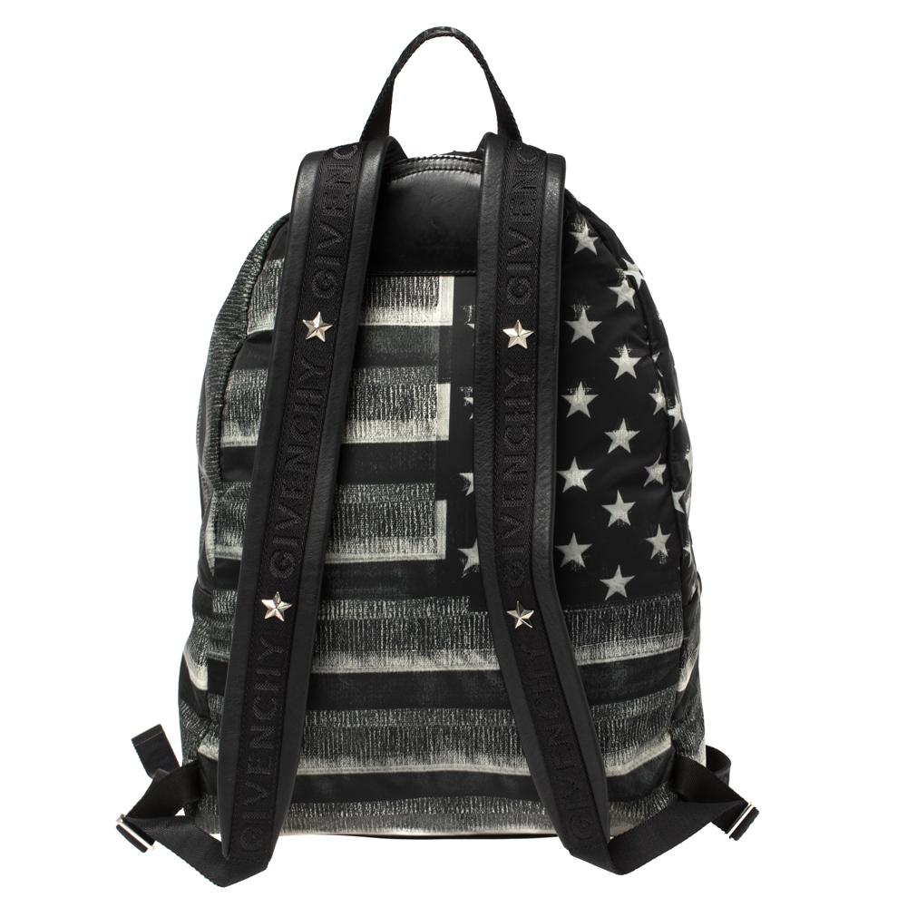 This Givenchy bag will help you put together an effortlessly stylish look. An ideal black bag that exudes modernity and class. It has been made from nylon featuring an American flag print, a front pocket, and double zip closure. The backpack is