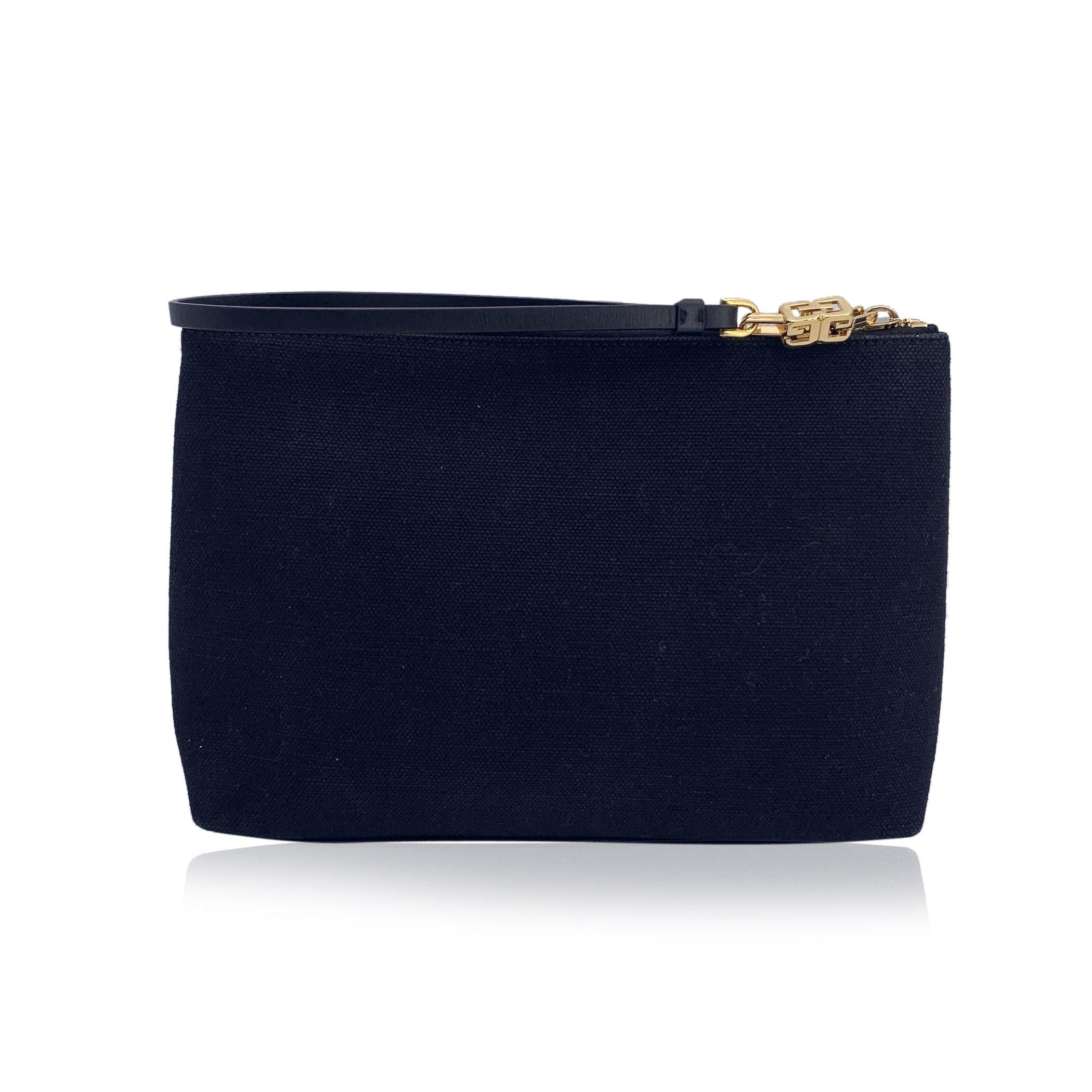 This beautiful Bag will come with a certificate of authenticity provided by third party authenticators. The certificate will be provided at no further cost. Givenchy clutch bag, crafted in black canvas with contrast logo on the front. Upper zipper