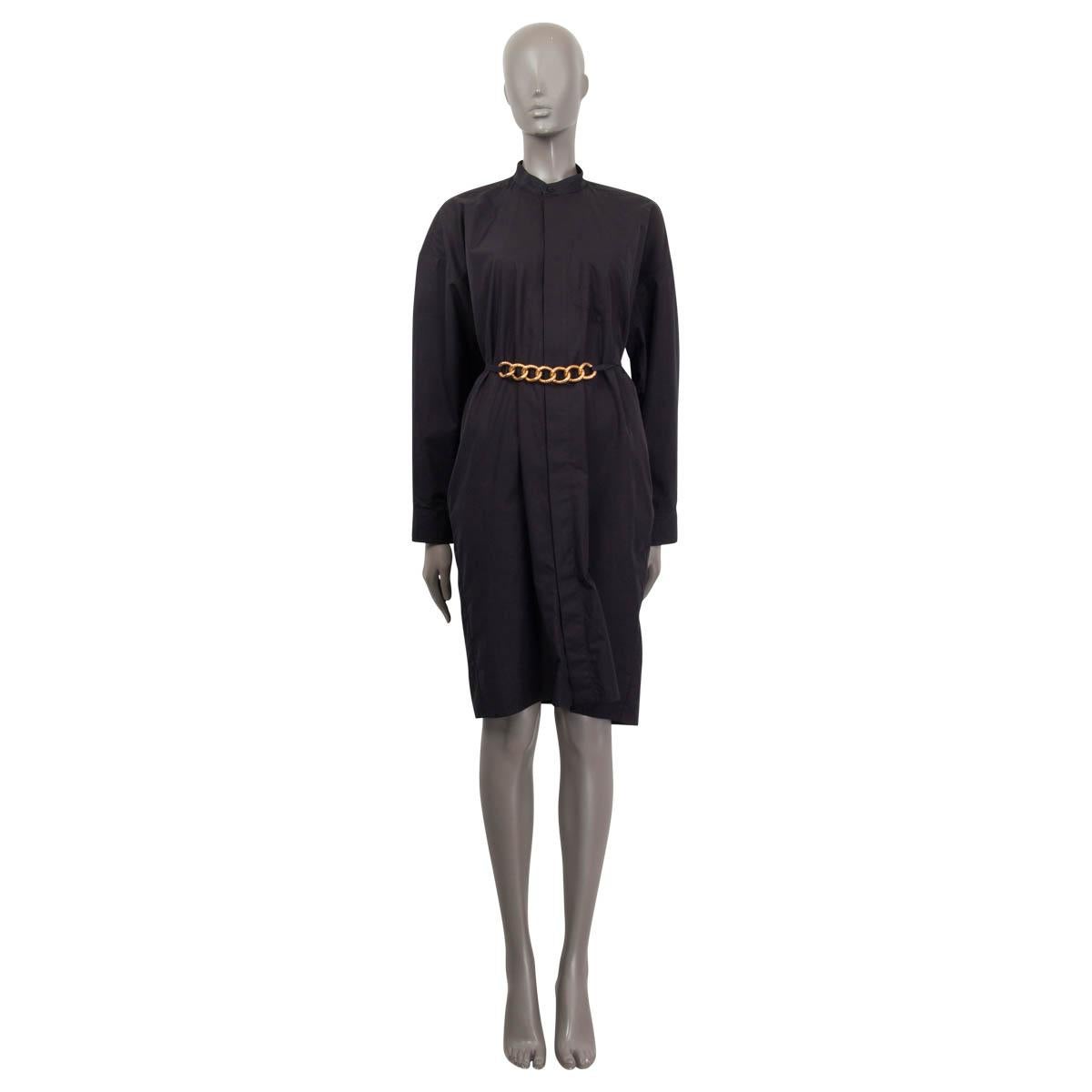 100% authentic Givenchy shirt dress in black cotton (100%). Features a chain-link detailed belt with a gold-tone hardware and a stand up collar. Has two side slit pockets and buttoned cuffs. Opens with nine buttons on the front. Unlined. Has been